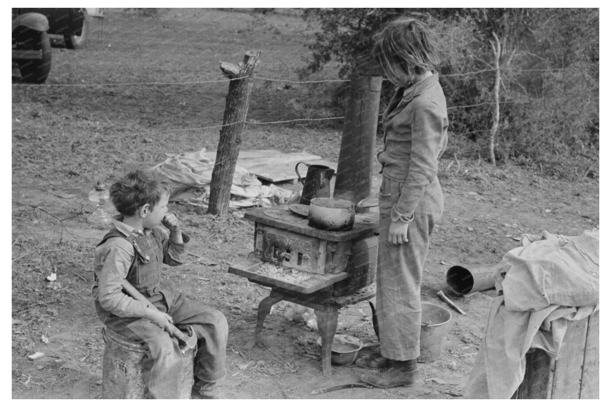 Child Adds Water to Boiling Beans Near Harlingen Texas 1939 - Available at KNOWOL