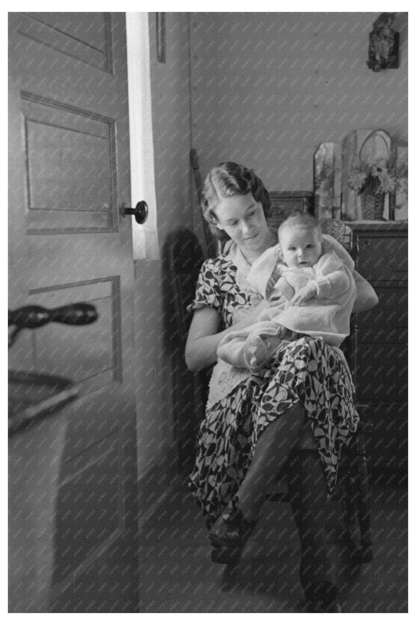 Child and Mother Reading Newspaper in Nissen Hut 1936 - Available at KNOWOL