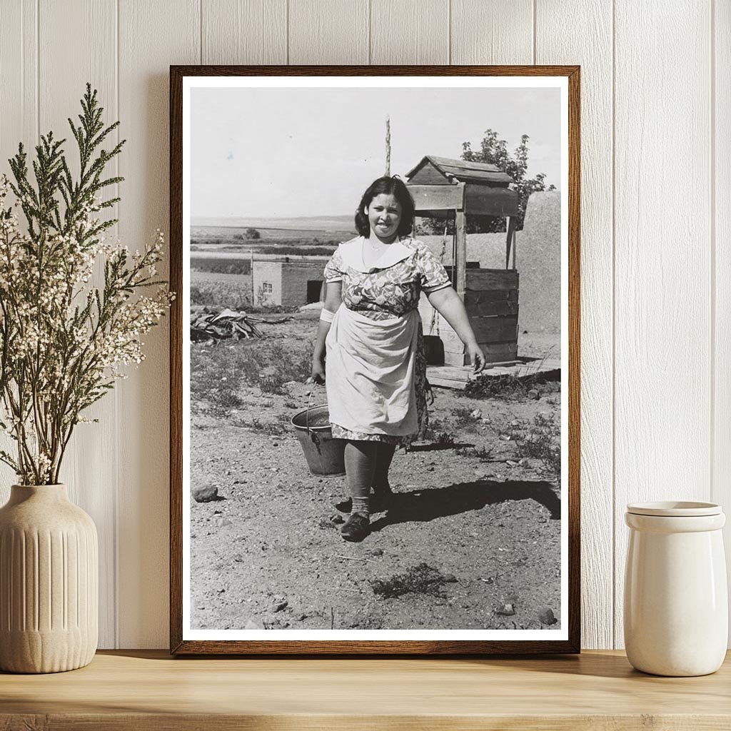 Child Carries Water from Well in Taos County 1939 - Available at KNOWOL