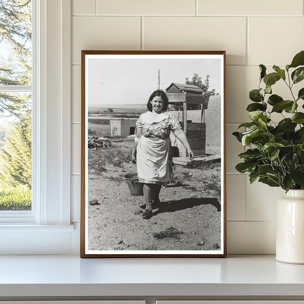 Child Carries Water from Well in Taos County 1939 - Available at KNOWOL