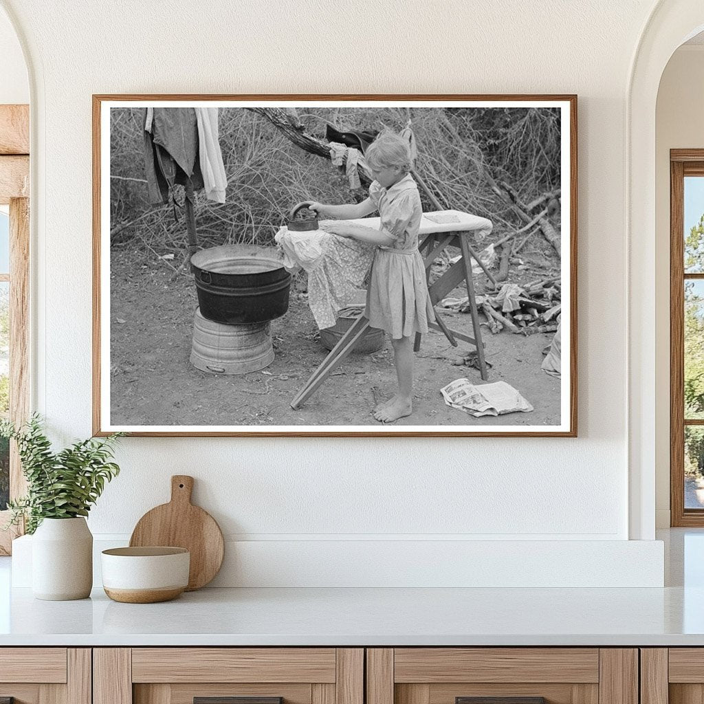Child Ironing in Migrant Camp Harlingen Texas 1939 - Available at KNOWOL