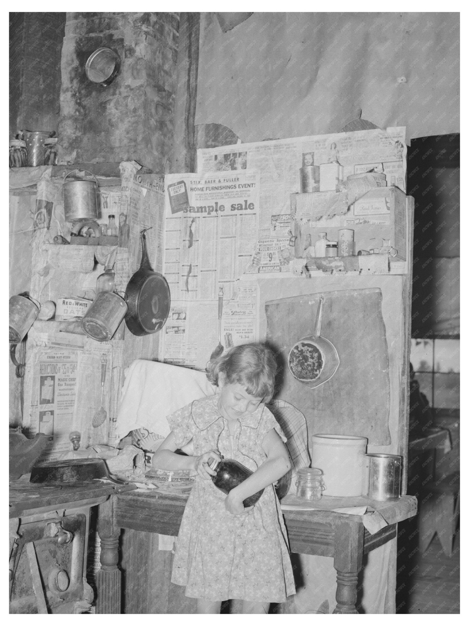 Child Opening Jar of Fruit on Missouri Farm 1938 - Available at KNOWOL