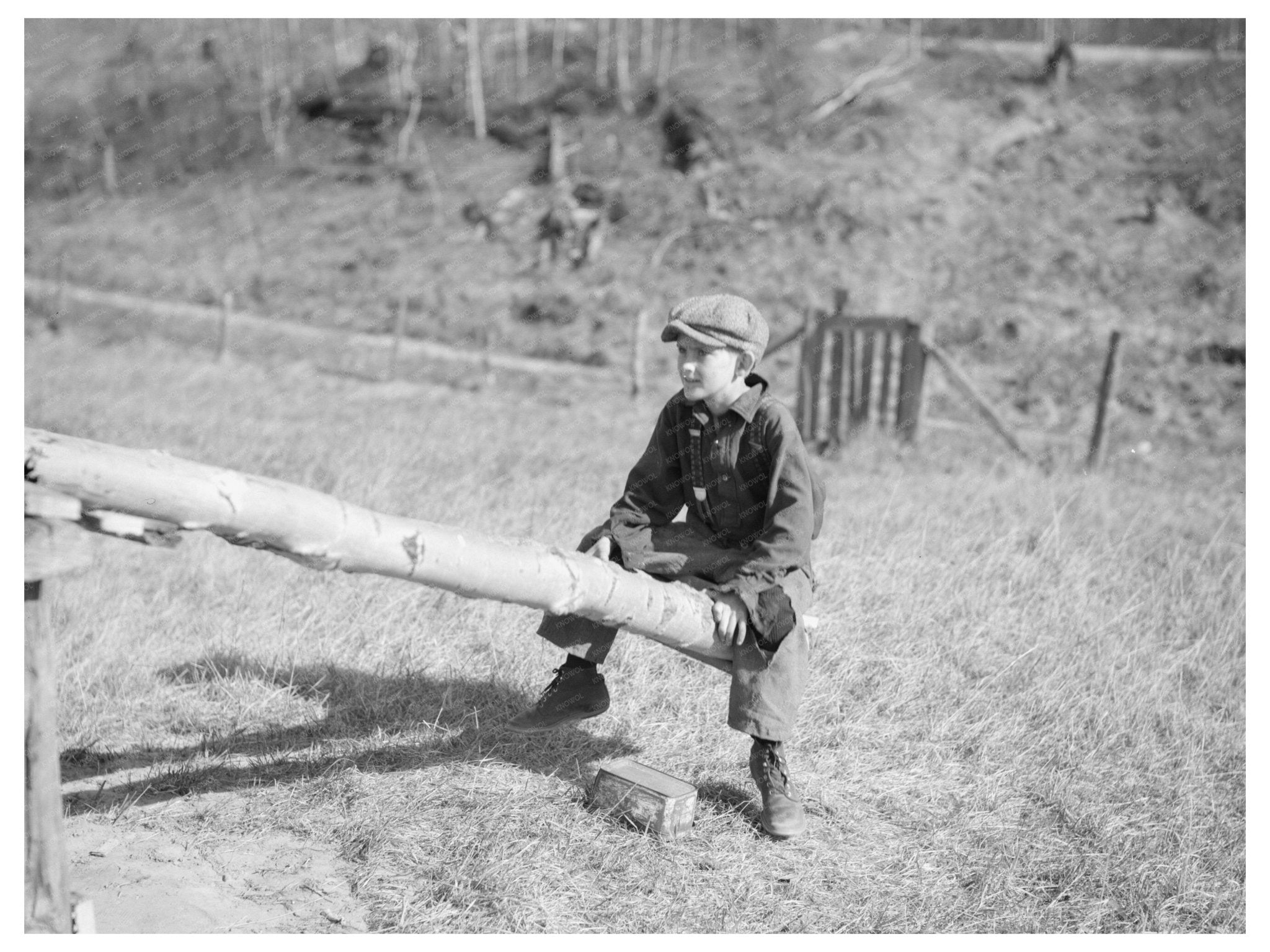 Child Playing on Homemade Teeter - Totter Long Lake 1937 - Available at KNOWOL