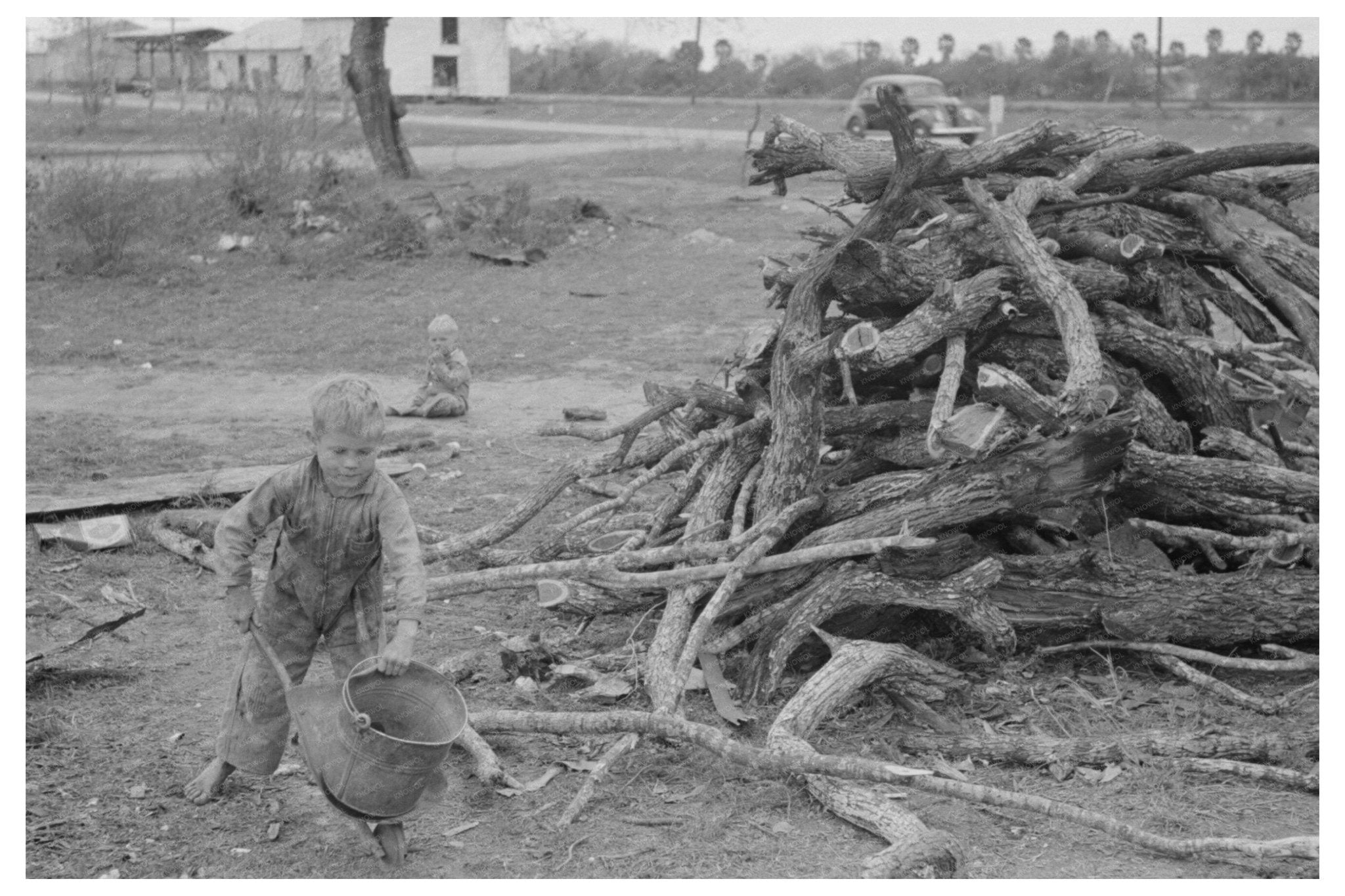 Child Playing with Automobile Tools Harlingen Texas 1939 - Available at KNOWOL