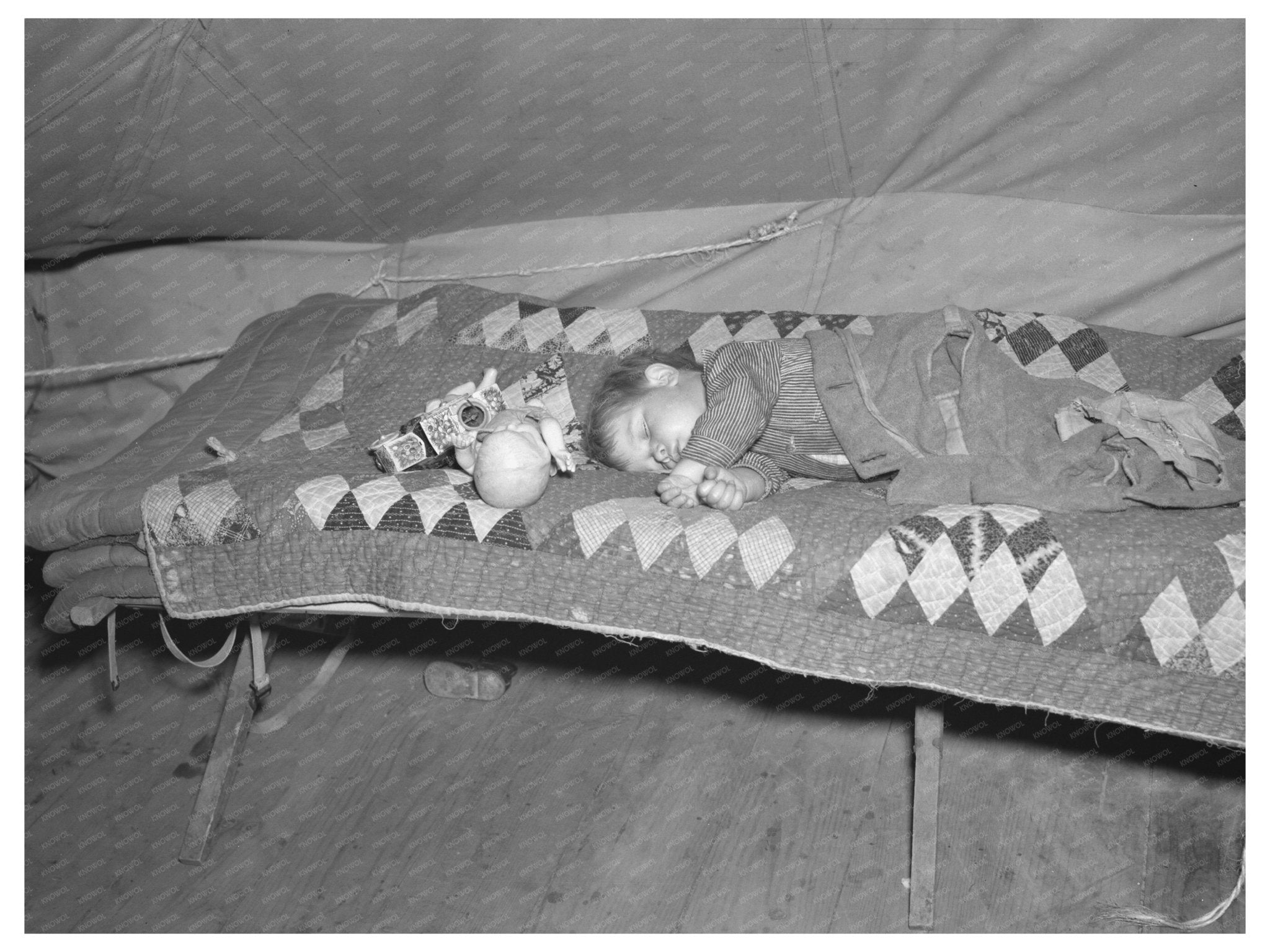 Child Refugee Napping in Tent City Illinois April 1937 - Available at KNOWOL
