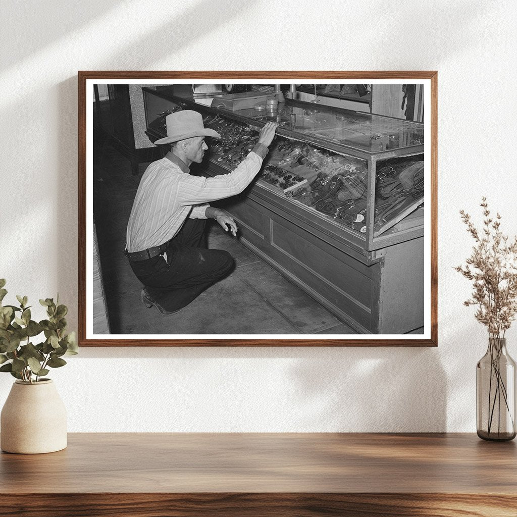 Cowboy Examining Spurs in Alpine Texas 1939 - Available at KNOWOL