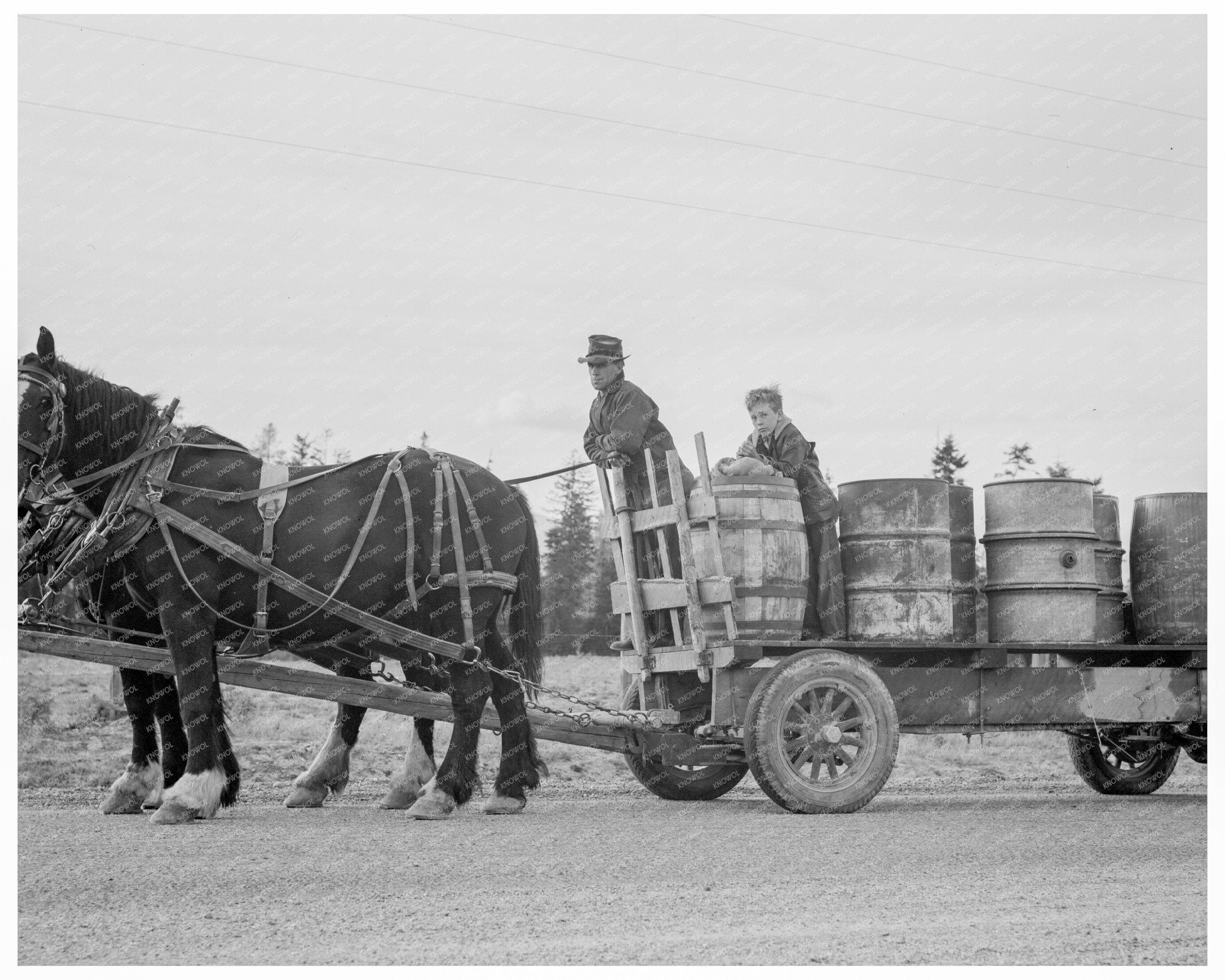 Farmer and Son Hauling Water Idaho 1939 - Available at KNOWOL