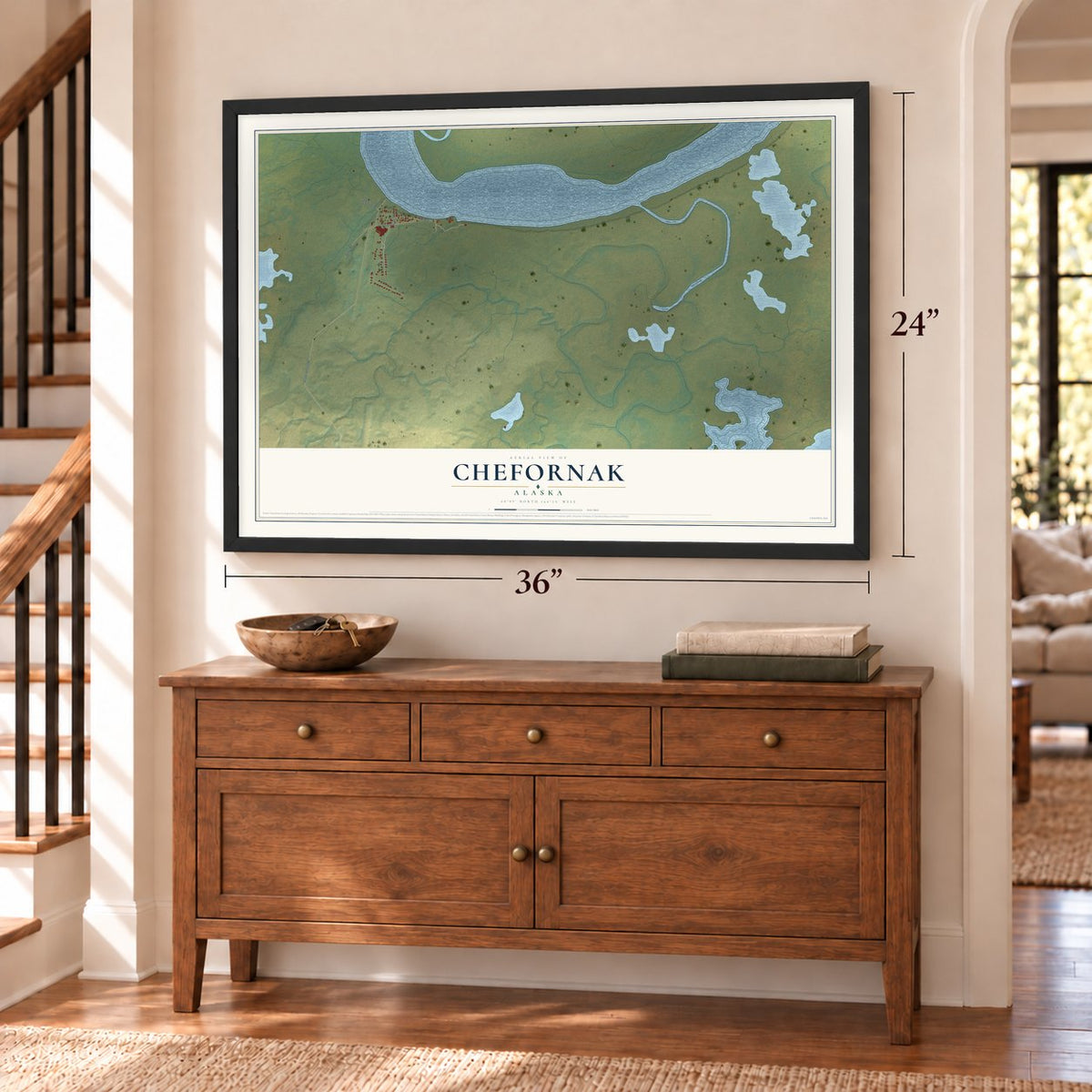 Chefornak, Alaska map, 24 x 36 inch print in a black frame above a dresser by a staircase