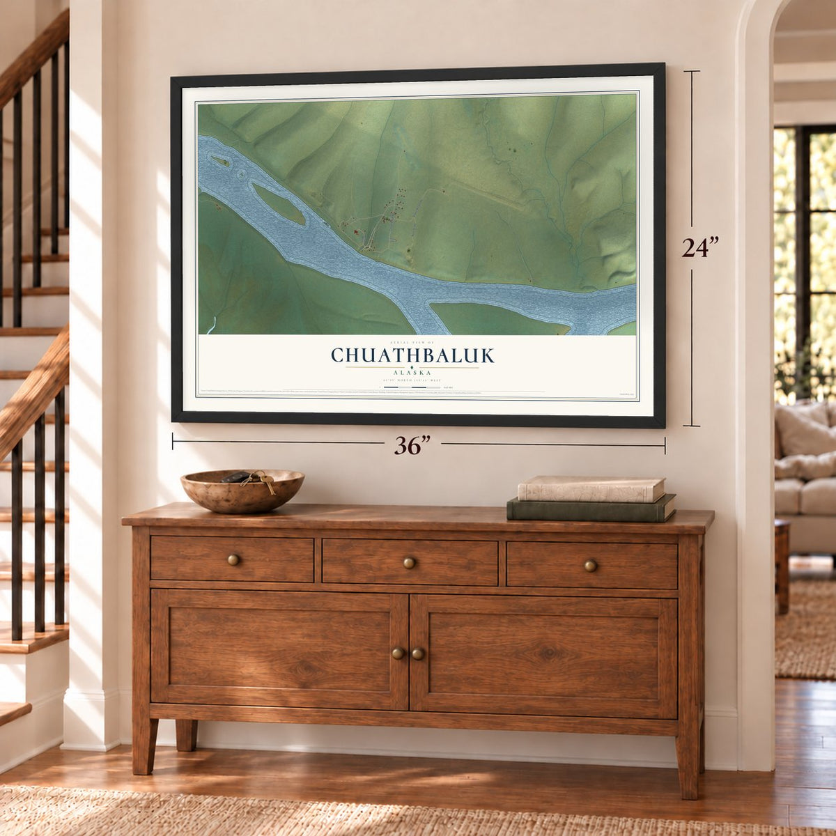 Chuathbaluk, Alaska map, 24 x 36 inch print in a black frame above a dresser by a staircase
