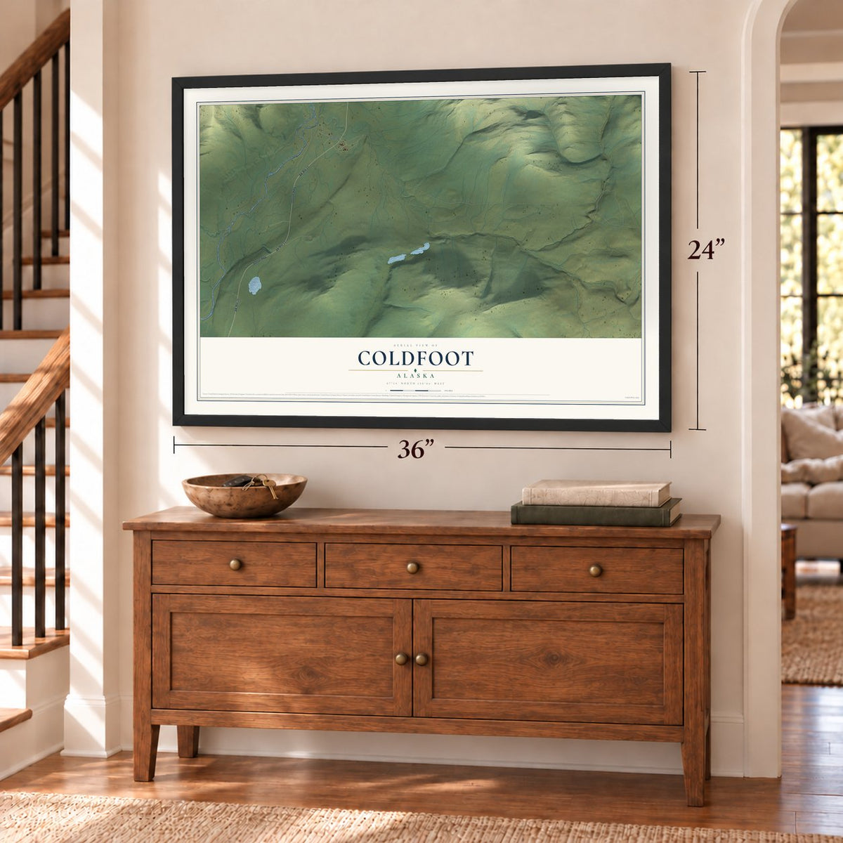 Coldfoot, Alaska map, 24 x 36 inch print in a black frame above a dresser by a staircase