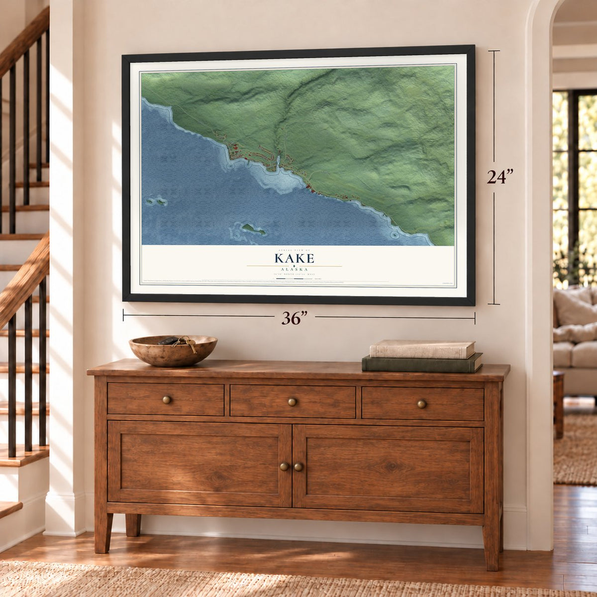 Kake, Alaska map, 24 x 36 inch print in a black frame above a dresser by a staircase