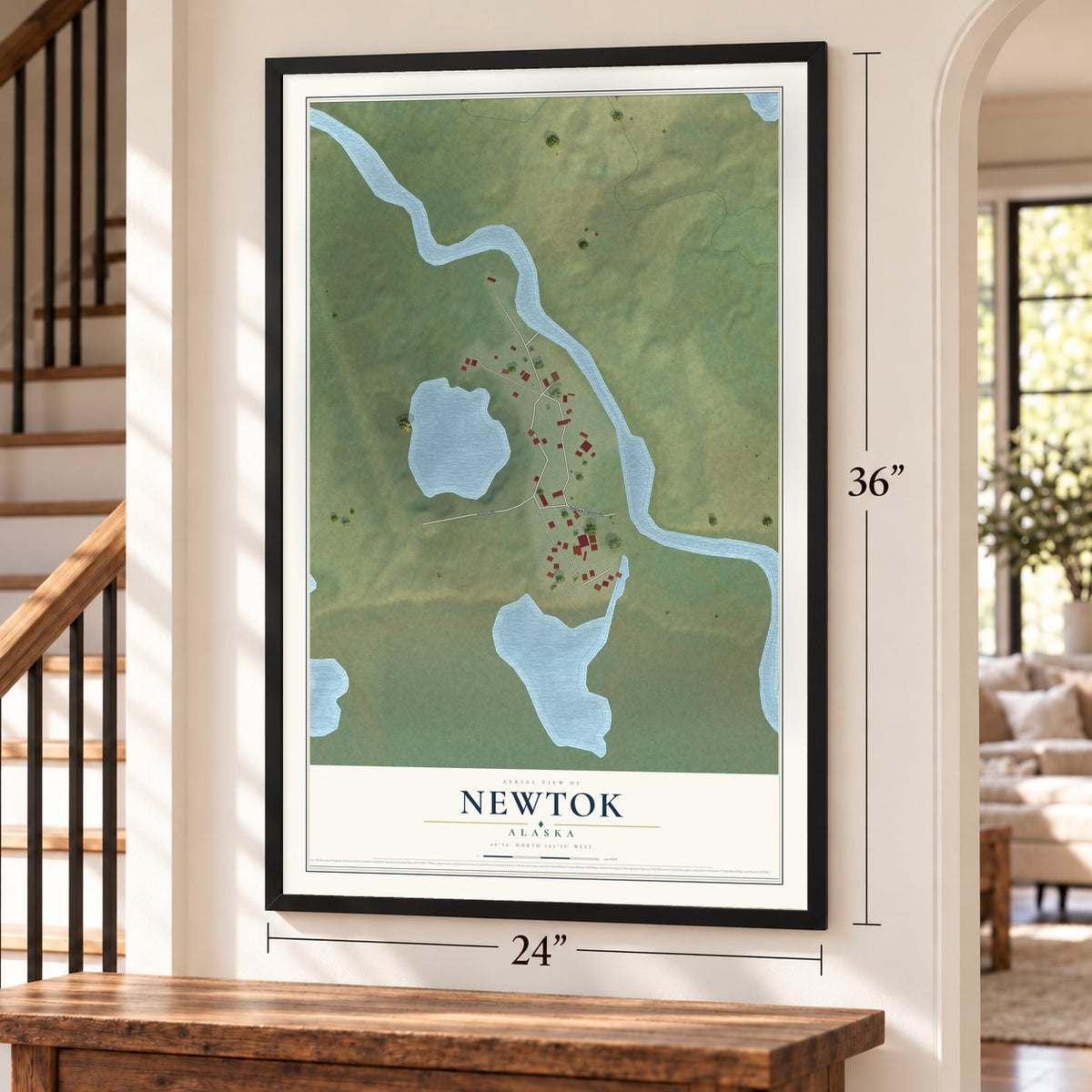 Newtok, Alaska map, 24 x 36 inch print in a black frame by a staircase