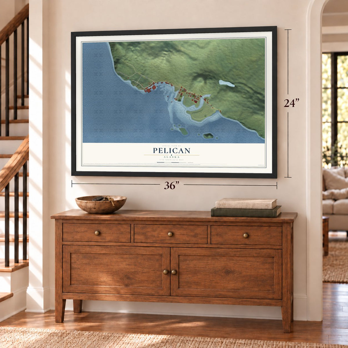 Pelican, Alaska map, 24 x 36 inch print in a black frame above a dresser by a staircase