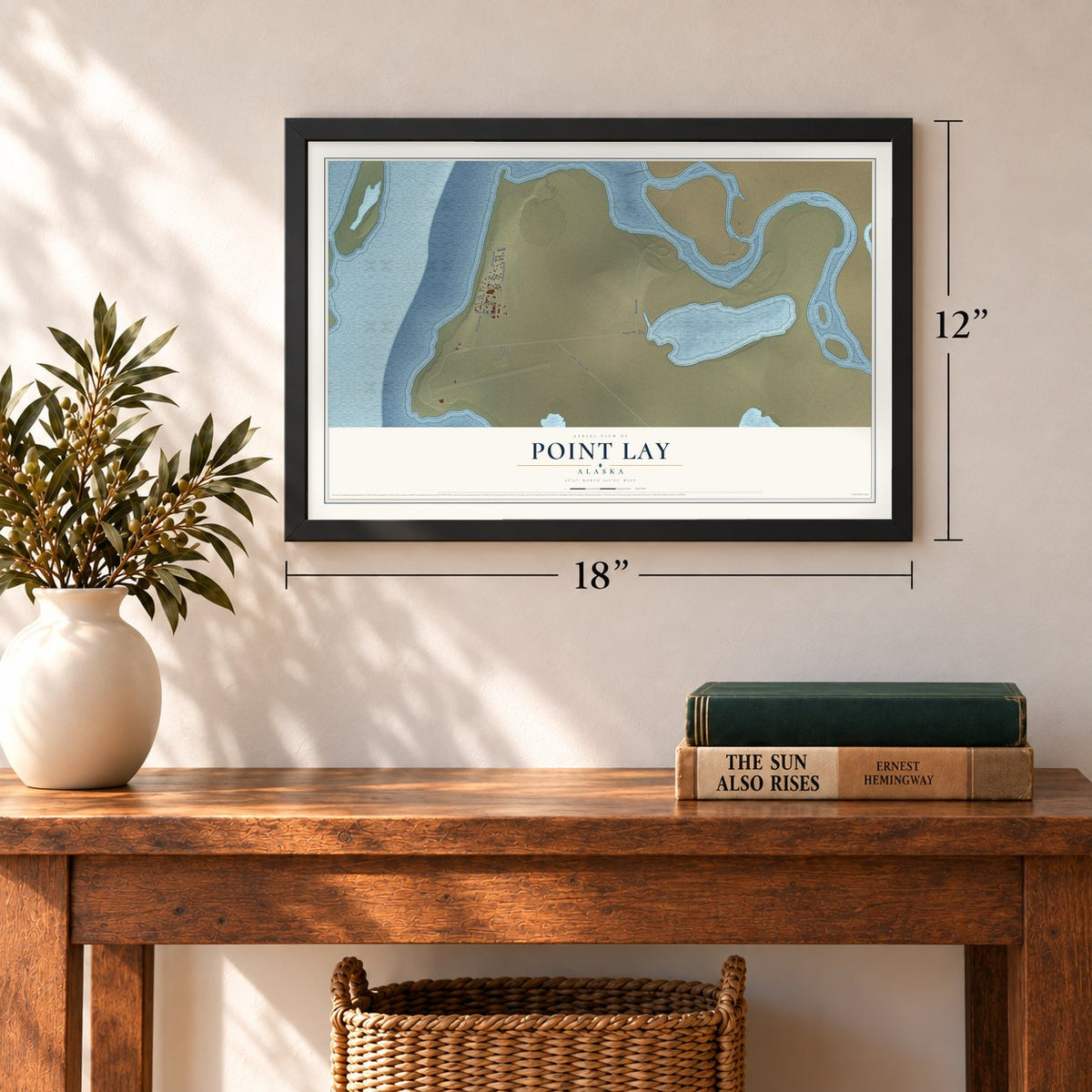 Point Lay, Alaska map, 12 x 18 inch print in a black frame in an entryway
