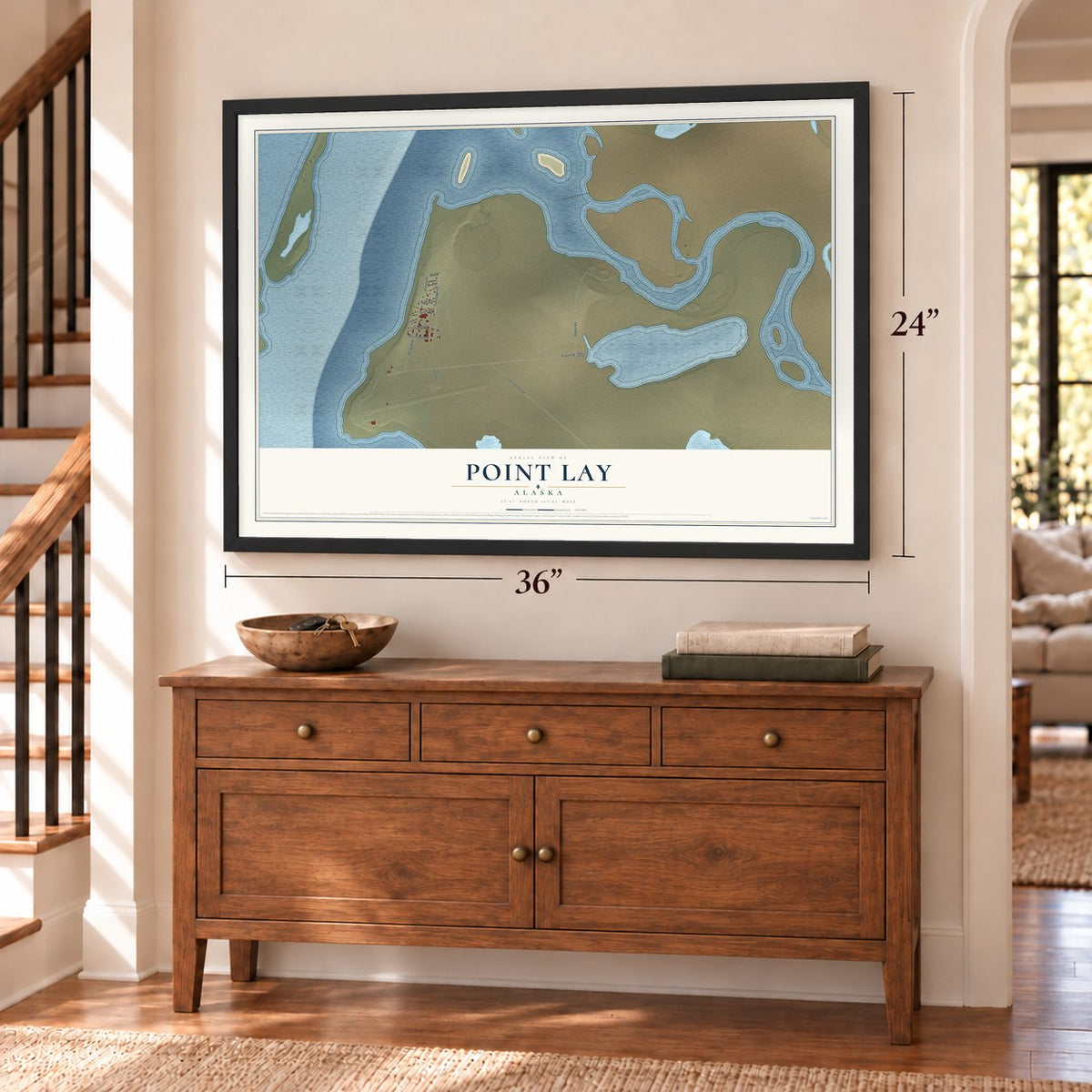 Point Lay, Alaska map, 24 x 36 inch print in a black frame above a dresser by a staircase