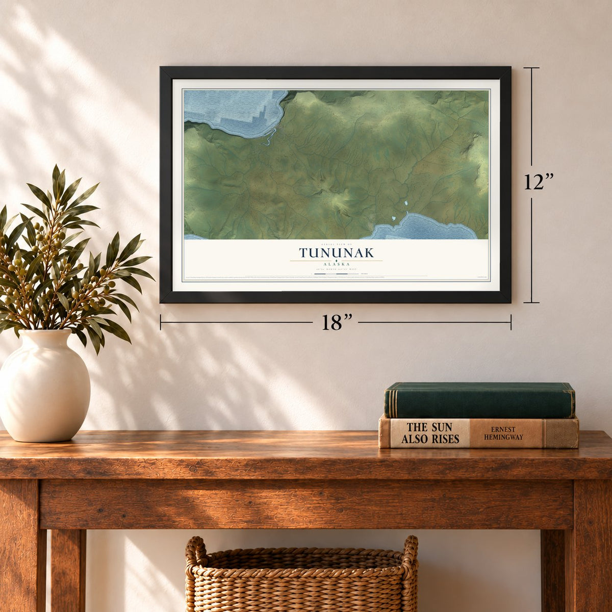 Tununak, Alaska map, 12 x 18 inch print in a black frame in an entryway