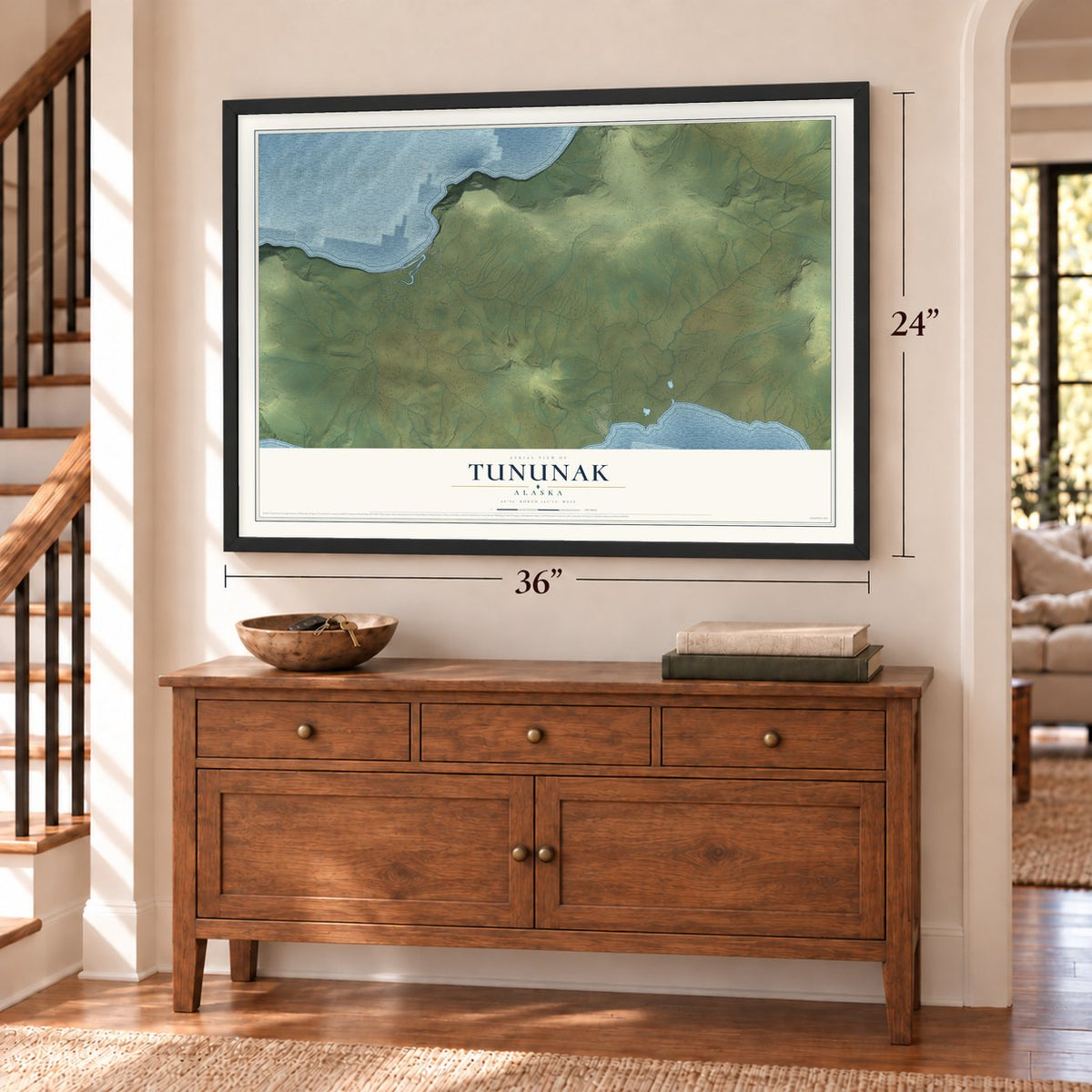 Tununak, Alaska map, 24 x 36 inch print in a black frame above a dresser by a staircase