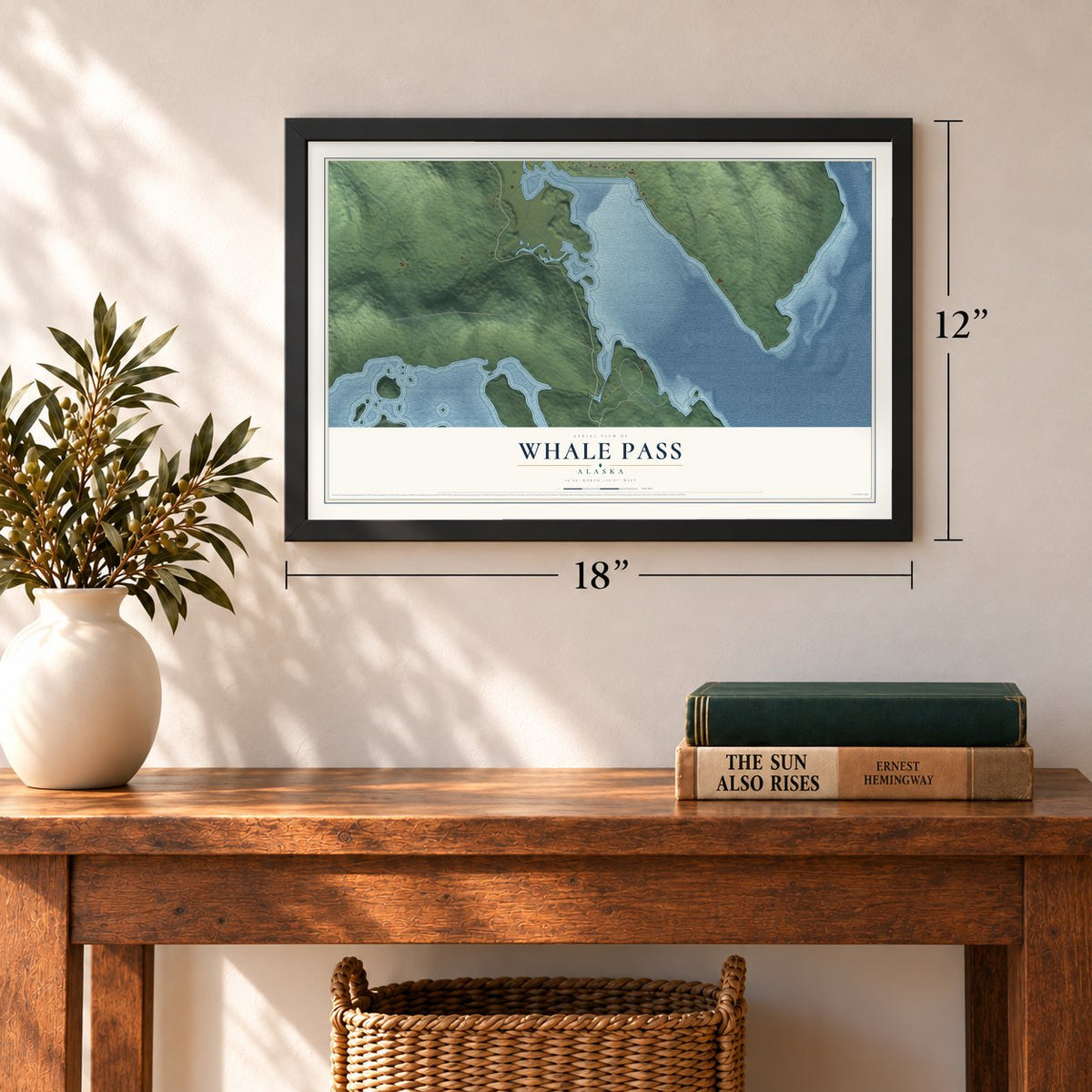 Whale Pass, Alaska map, 12 x 18 inch print in a black frame in an entryway