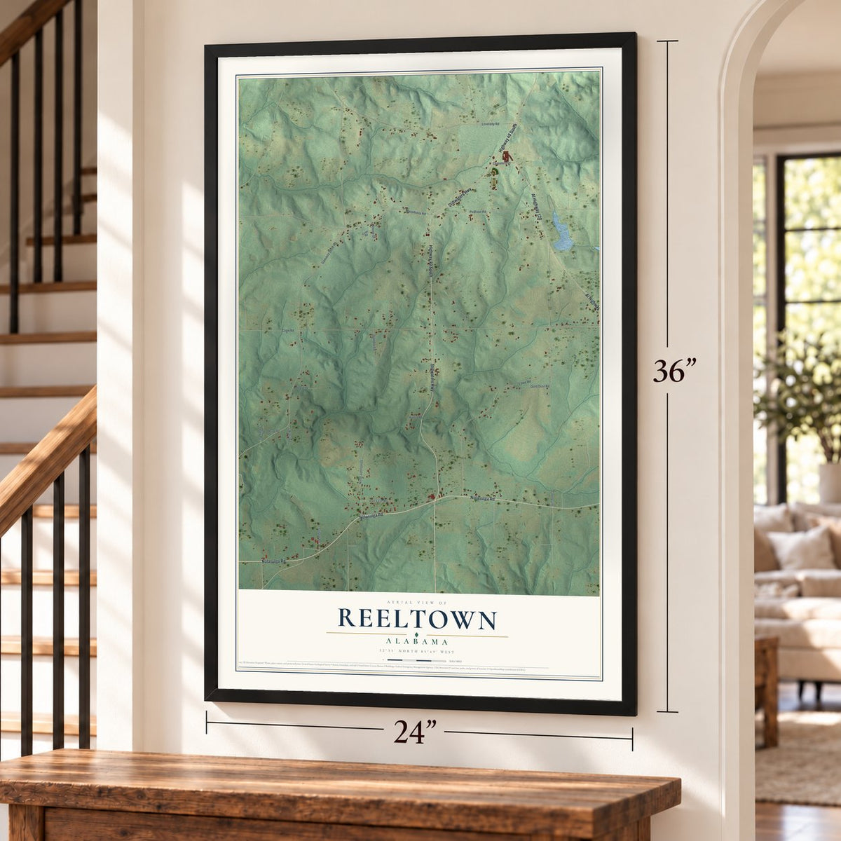 Reeltown, Alabama map, 24 x 36 inch print in a black frame by a staircase