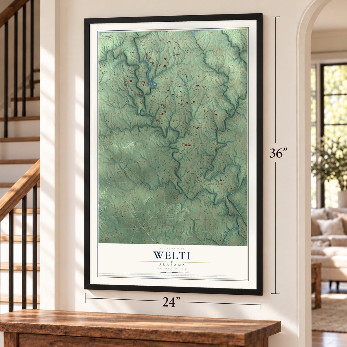 Welti, Alabama map, 24 x 36 inch print in a black frame by a staircase