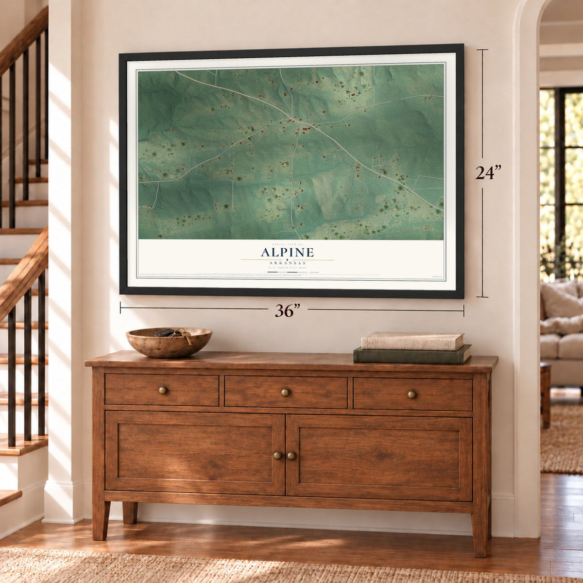 Alpine, Arkansas map, 24 x 36 inch print in a black frame above a dresser by a staircase