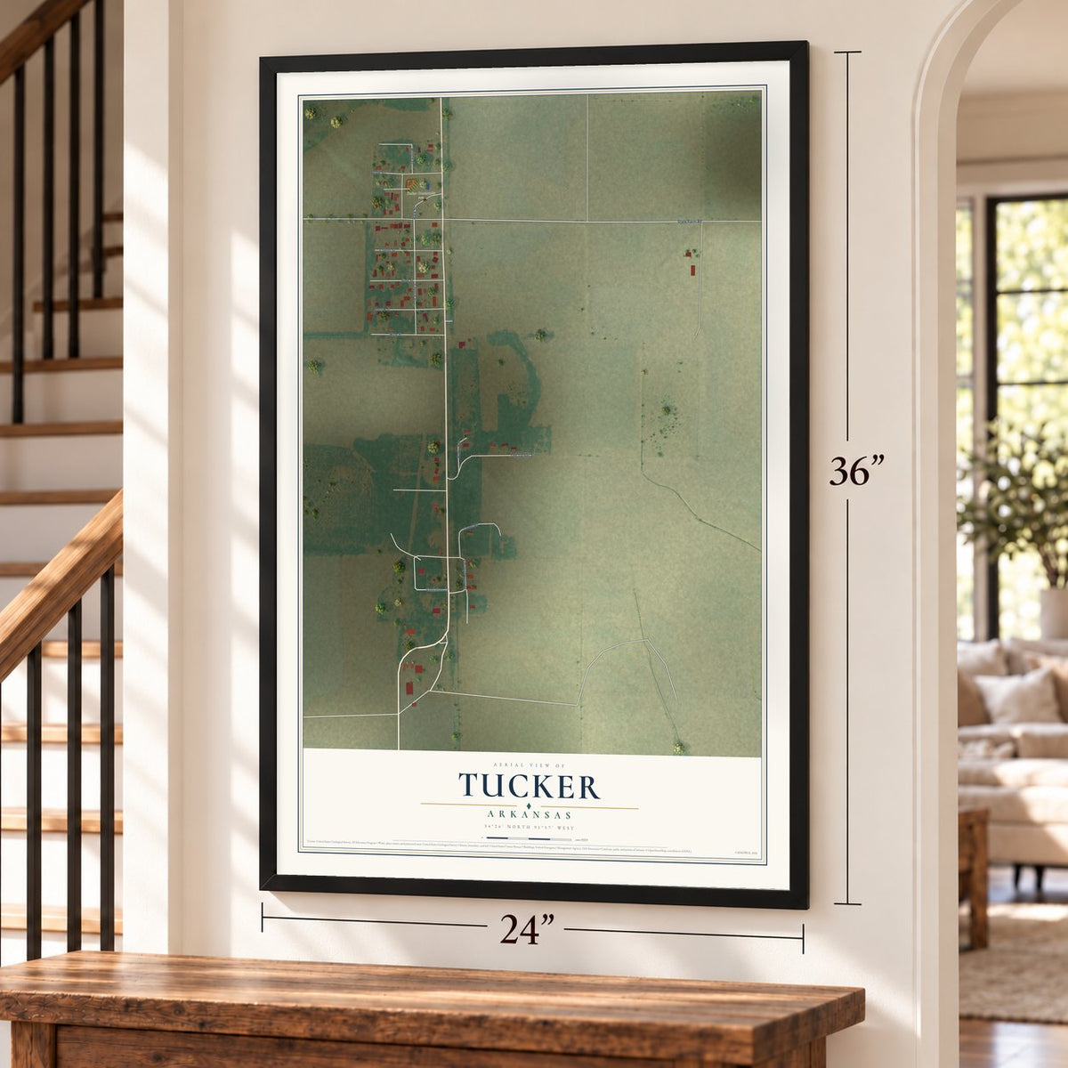 Tucker, Arkansas map, 24 x 36 inch print in a black frame by a staircase