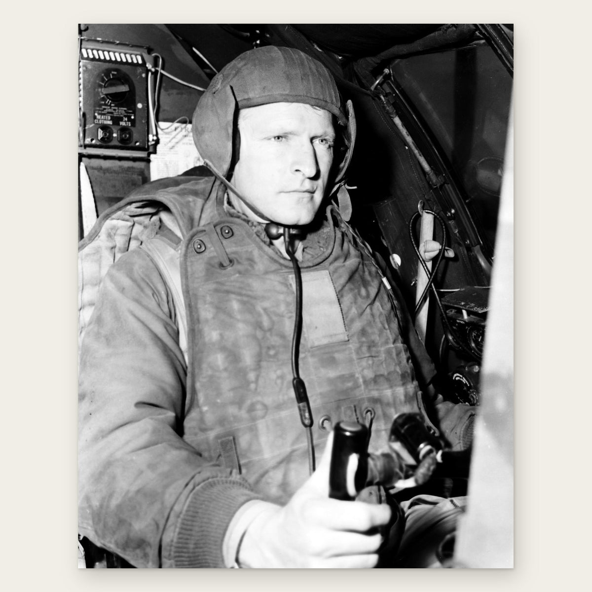 Captain Melvin E. Jarvis in a cloth flying helmet, throat microphone and heavy padded vest at the controls of his B-29 on Okinawa, May 1951, restored vintage photo print