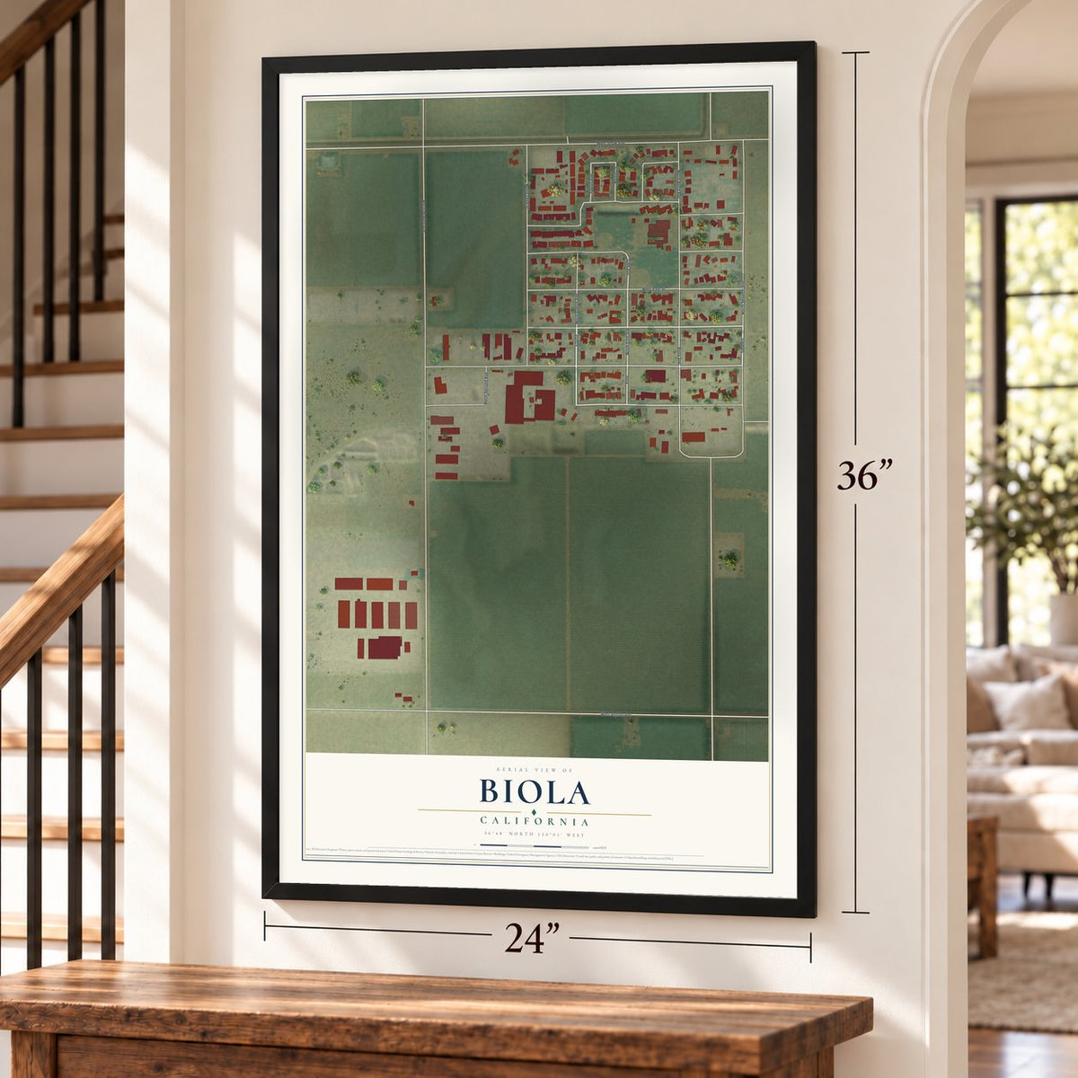 Biola, California map, 24 x 36 inch print in a black frame by a staircase