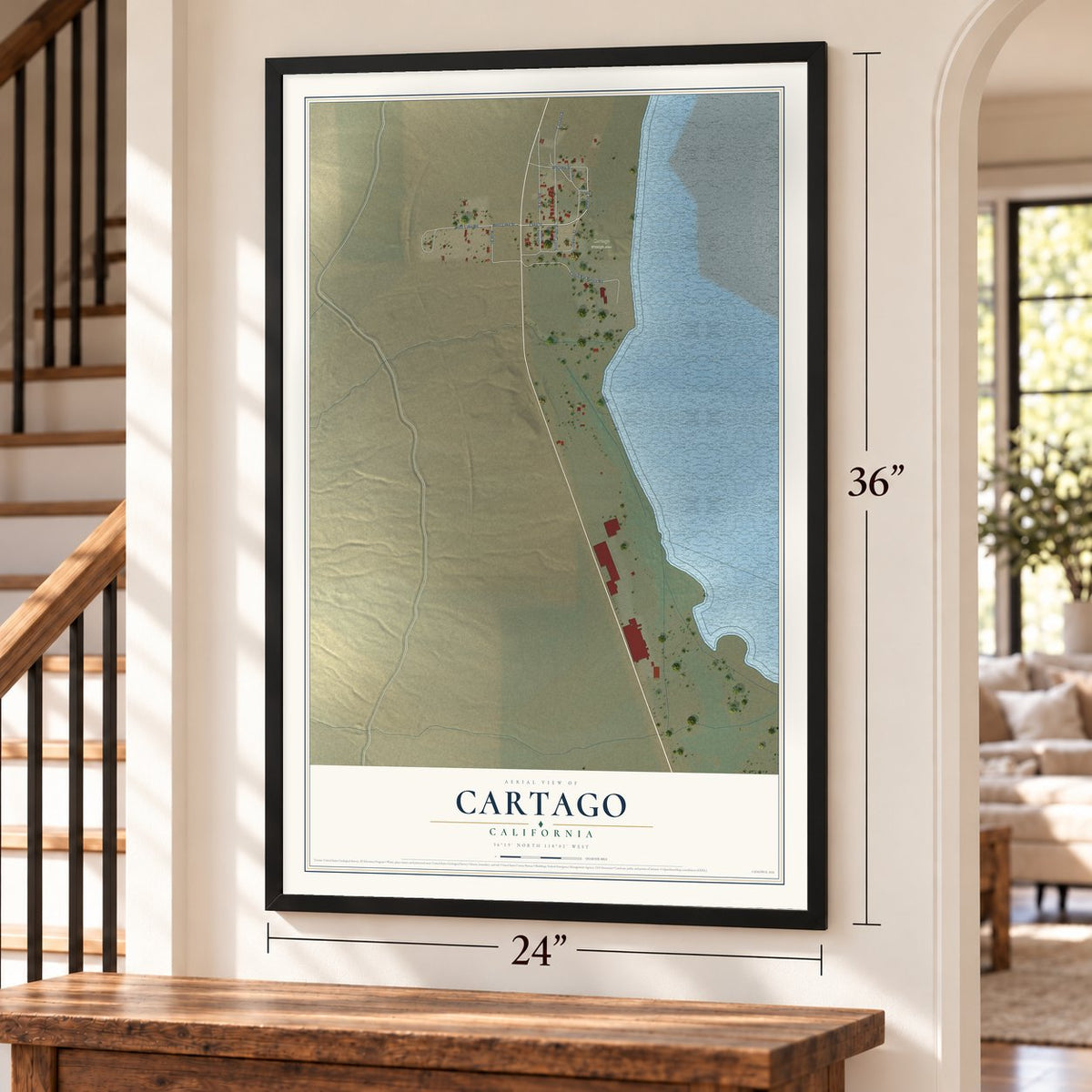 Cartago, California map, 24 x 36 inch print in a black frame by a staircase