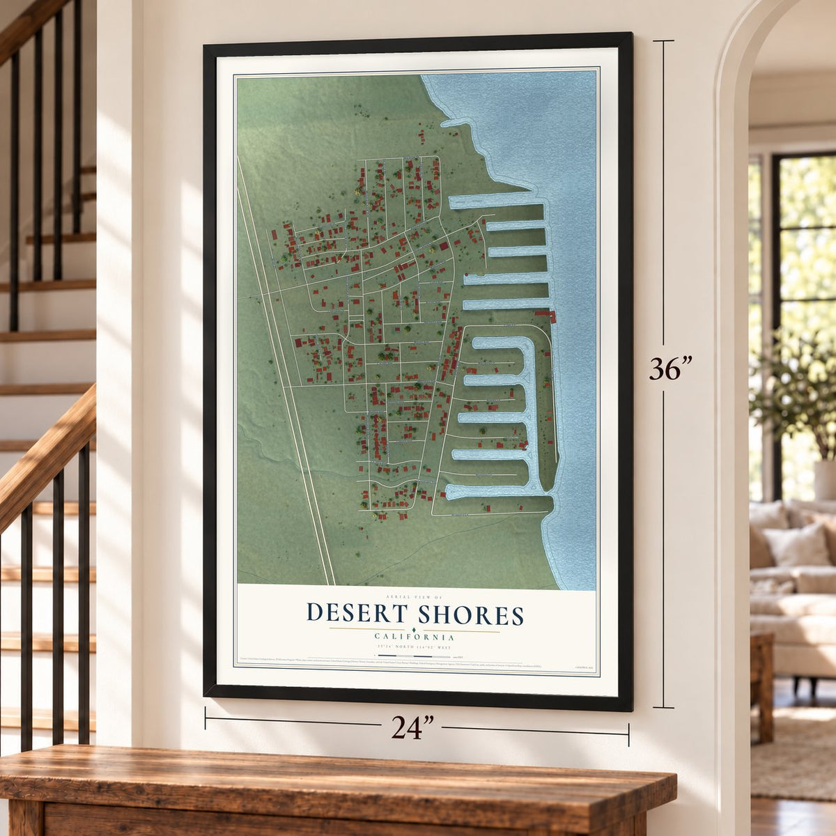 Desert Shores, California map, 24 x 36 inch print in a black frame by a staircase