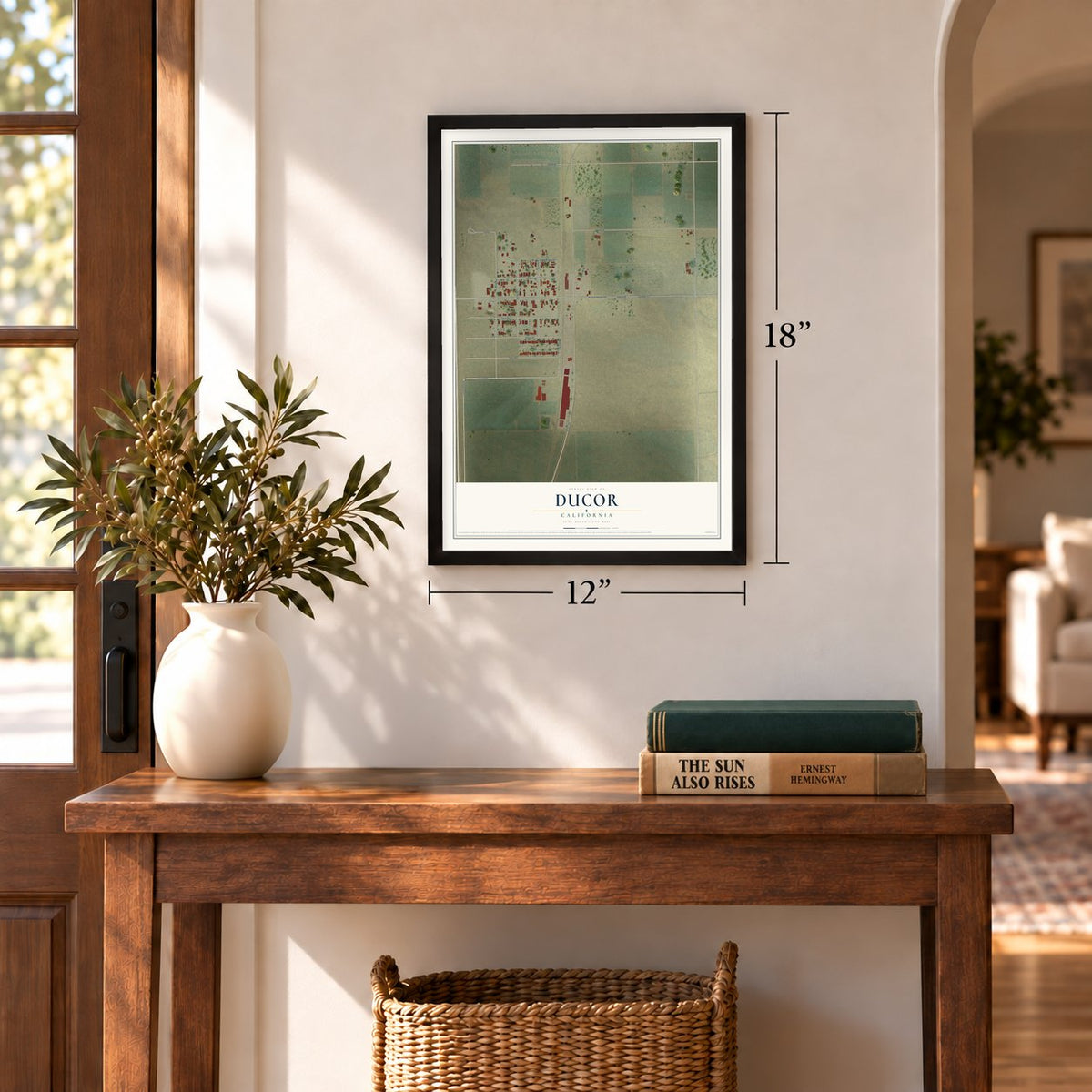 Ducor, California map, 12 x 18 inch print in a black frame in an entryway
