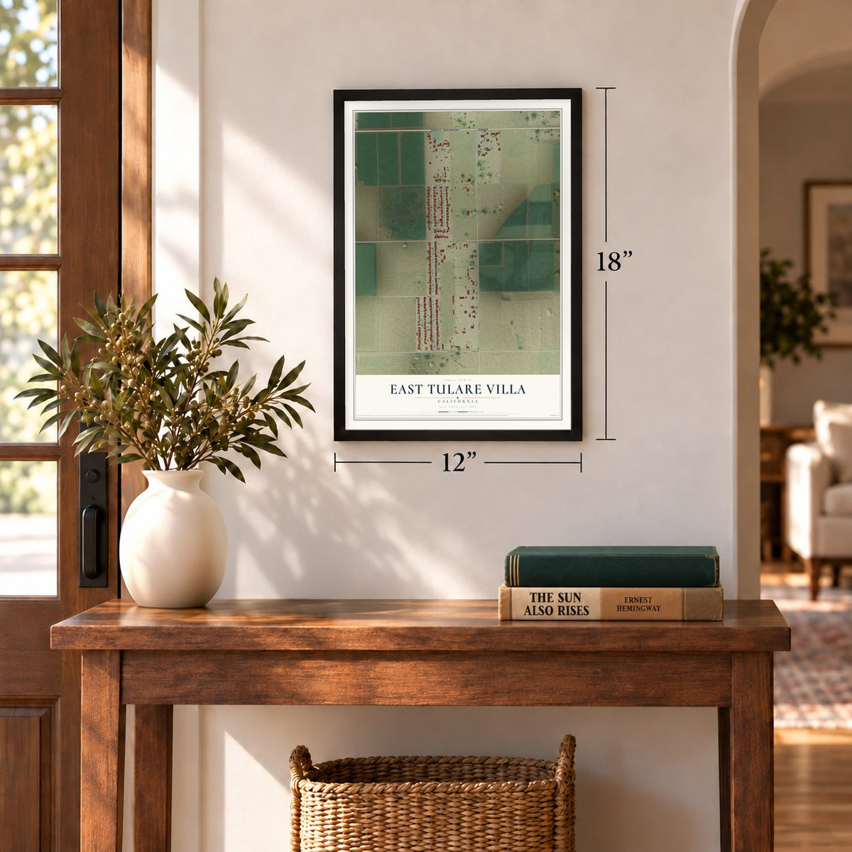 East Tulare Villa, California map, 12 x 18 inch print in a black frame in an entryway