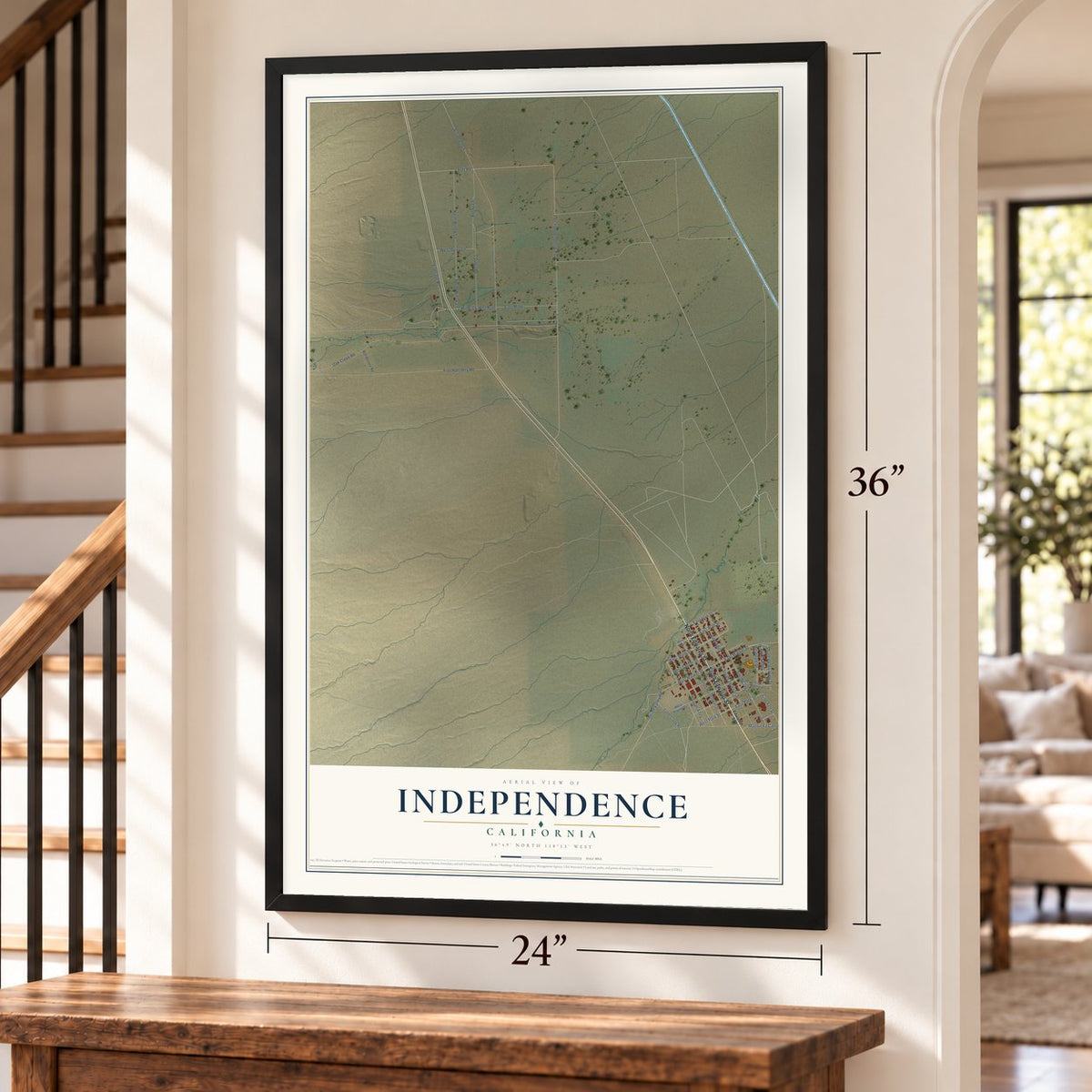 Independence, California map, 24 x 36 inch print in a black frame by a staircase