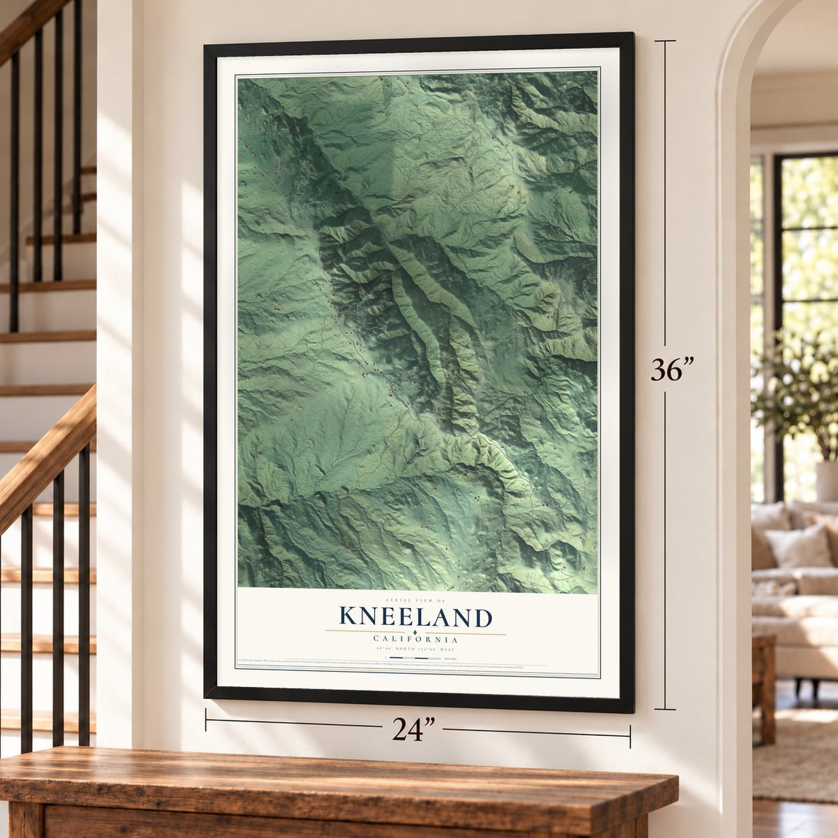 Kneeland, California map, 24 x 36 inch print in a black frame by a staircase