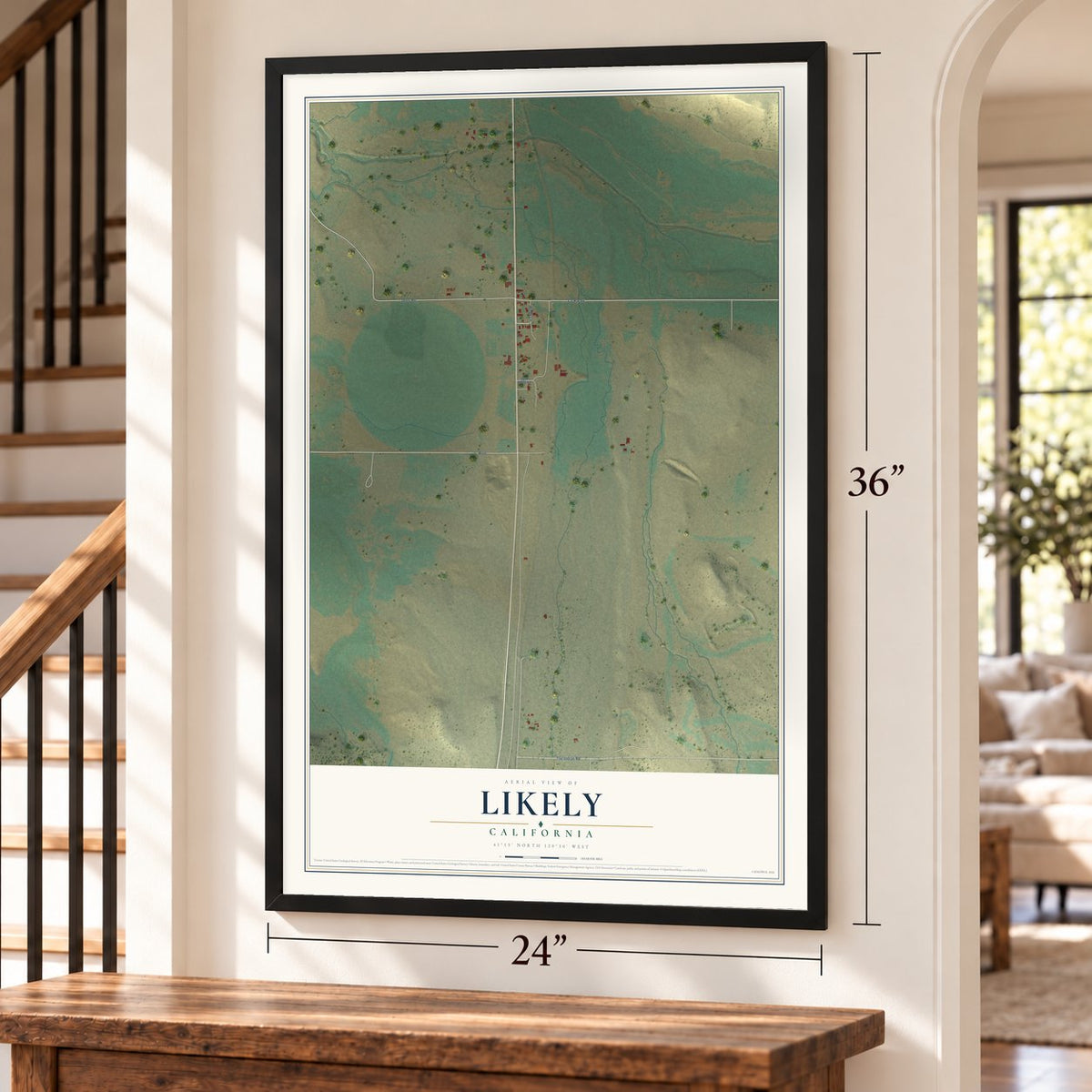 Likely, California map, 24 x 36 inch print in a black frame by a staircase
