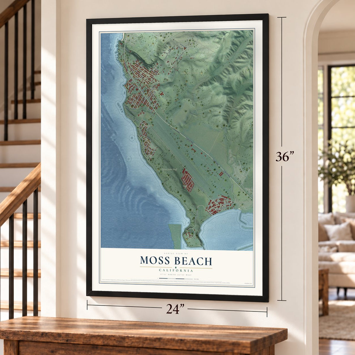 Moss Beach, California map, 24 x 36 inch print in a black frame by a staircase