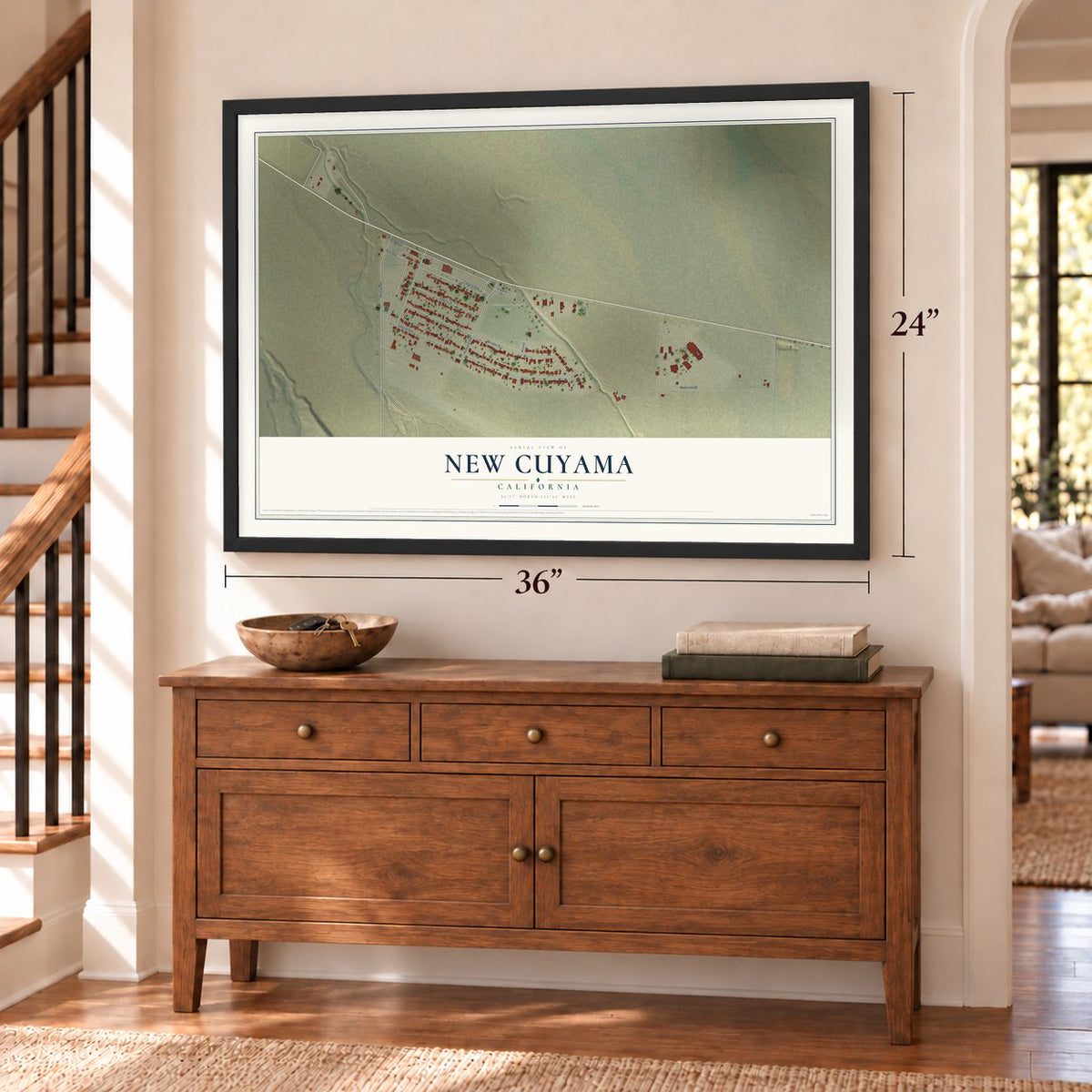 New Cuyama, California map, 24 x 36 inch print in a black frame above a dresser by a staircase