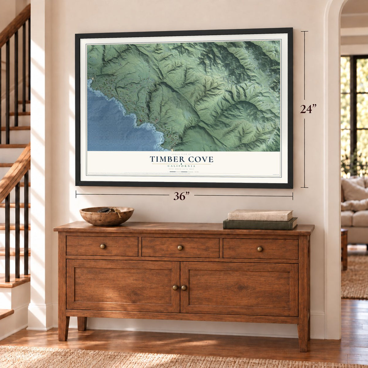 Timber Cove, California map, 24 x 36 inch print in a black frame above a dresser by a staircase