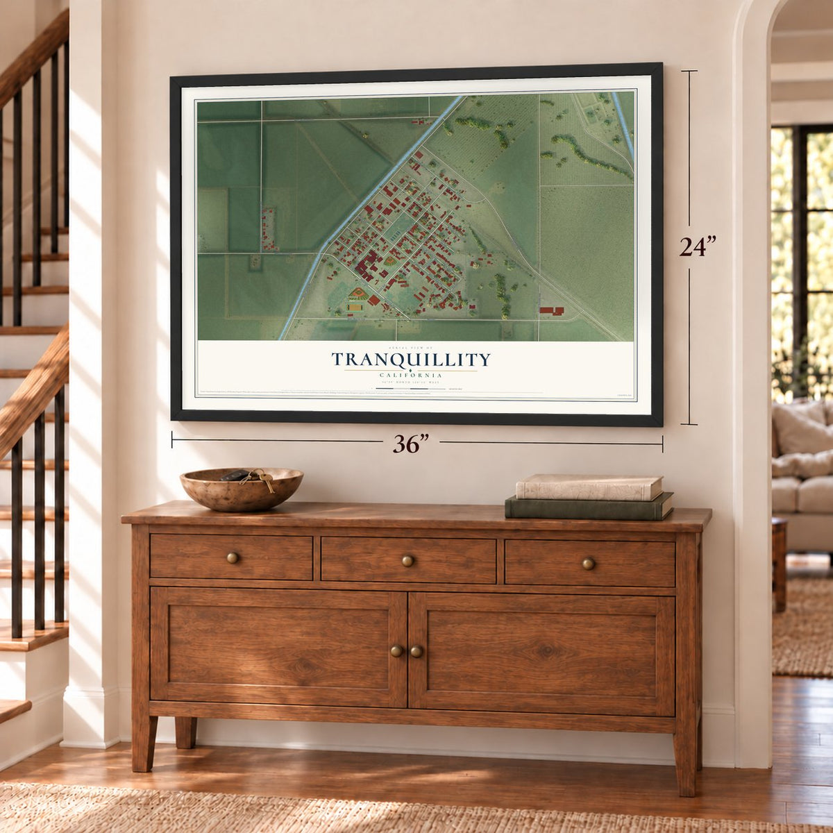 Tranquillity, California map, 24 x 36 inch print in a black frame above a dresser by a staircase