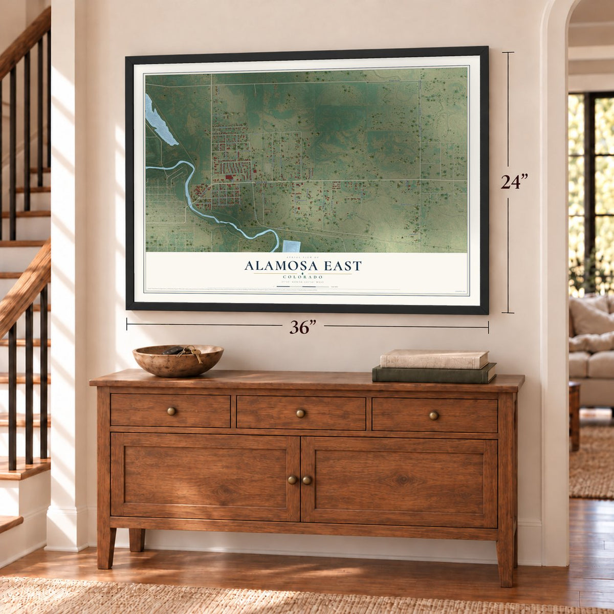 Alamosa East, Colorado map, 24 x 36 inch print in a black frame above a dresser by a staircase