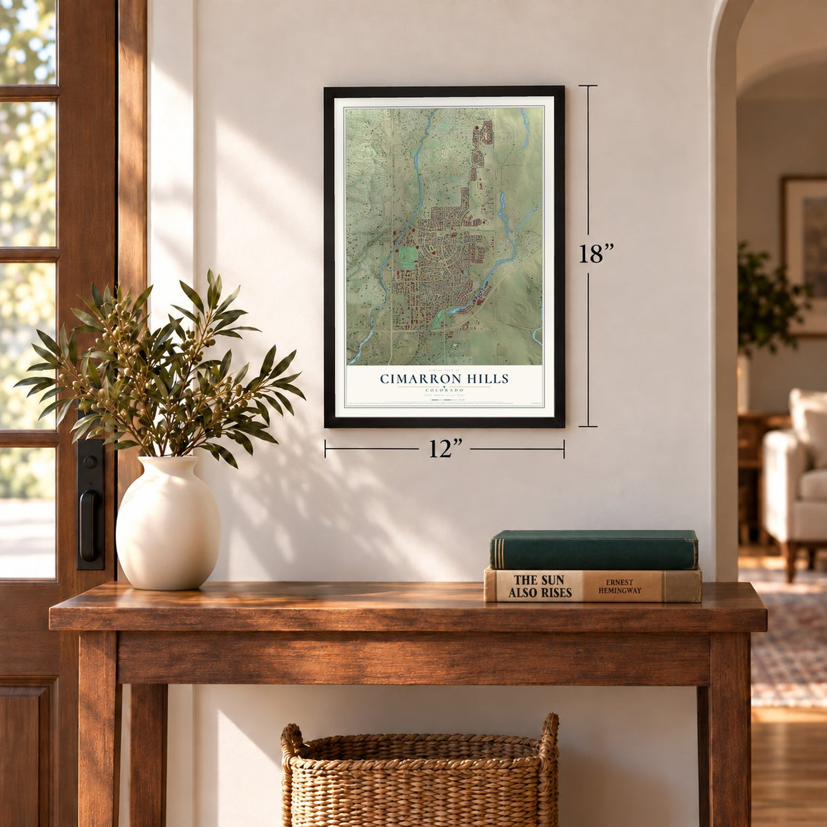Cimarron Hills, Colorado map, 12 x 18 inch print in a black frame in an entryway