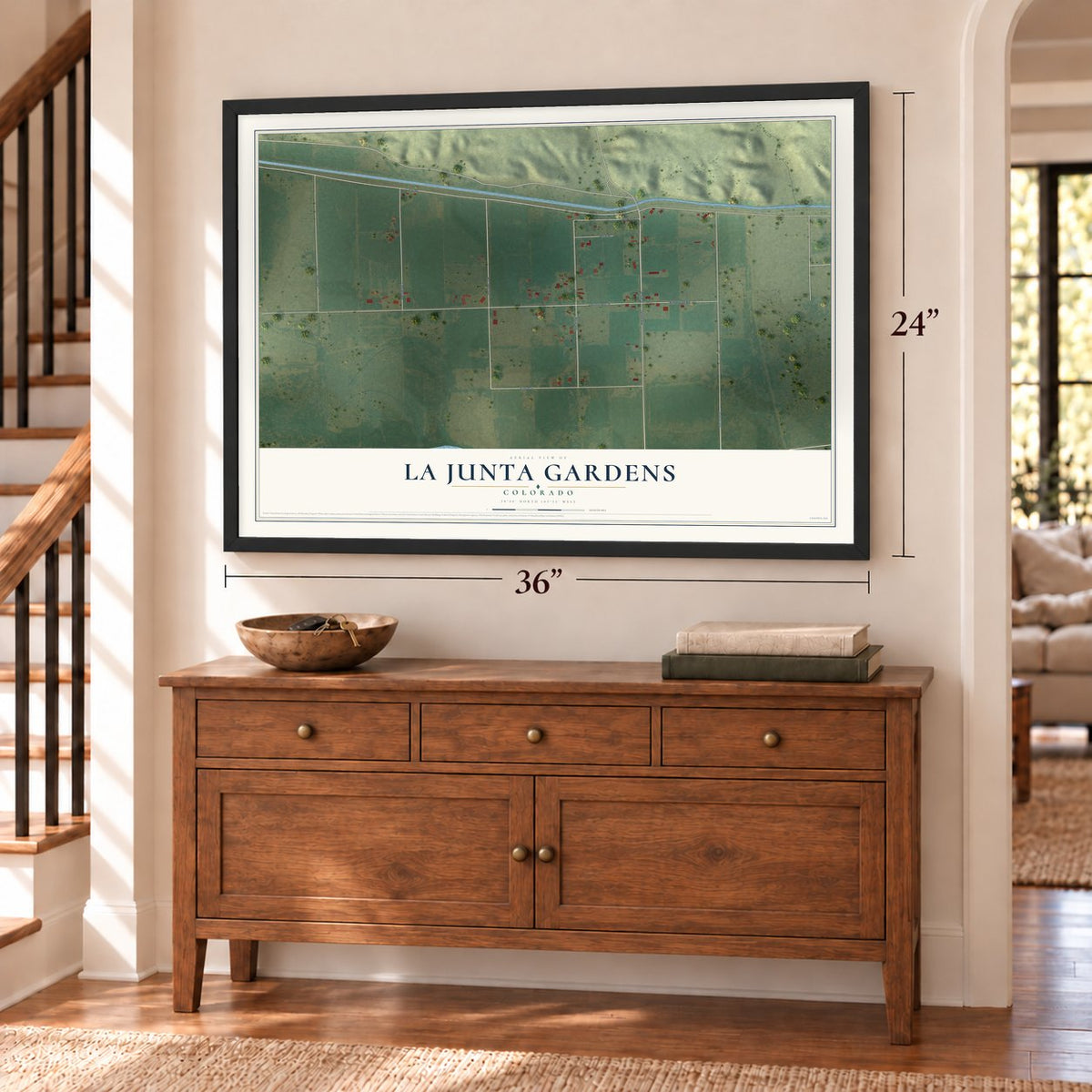 La Junta Gardens, Colorado map, 24 x 36 inch print in a black frame above a dresser by a staircase