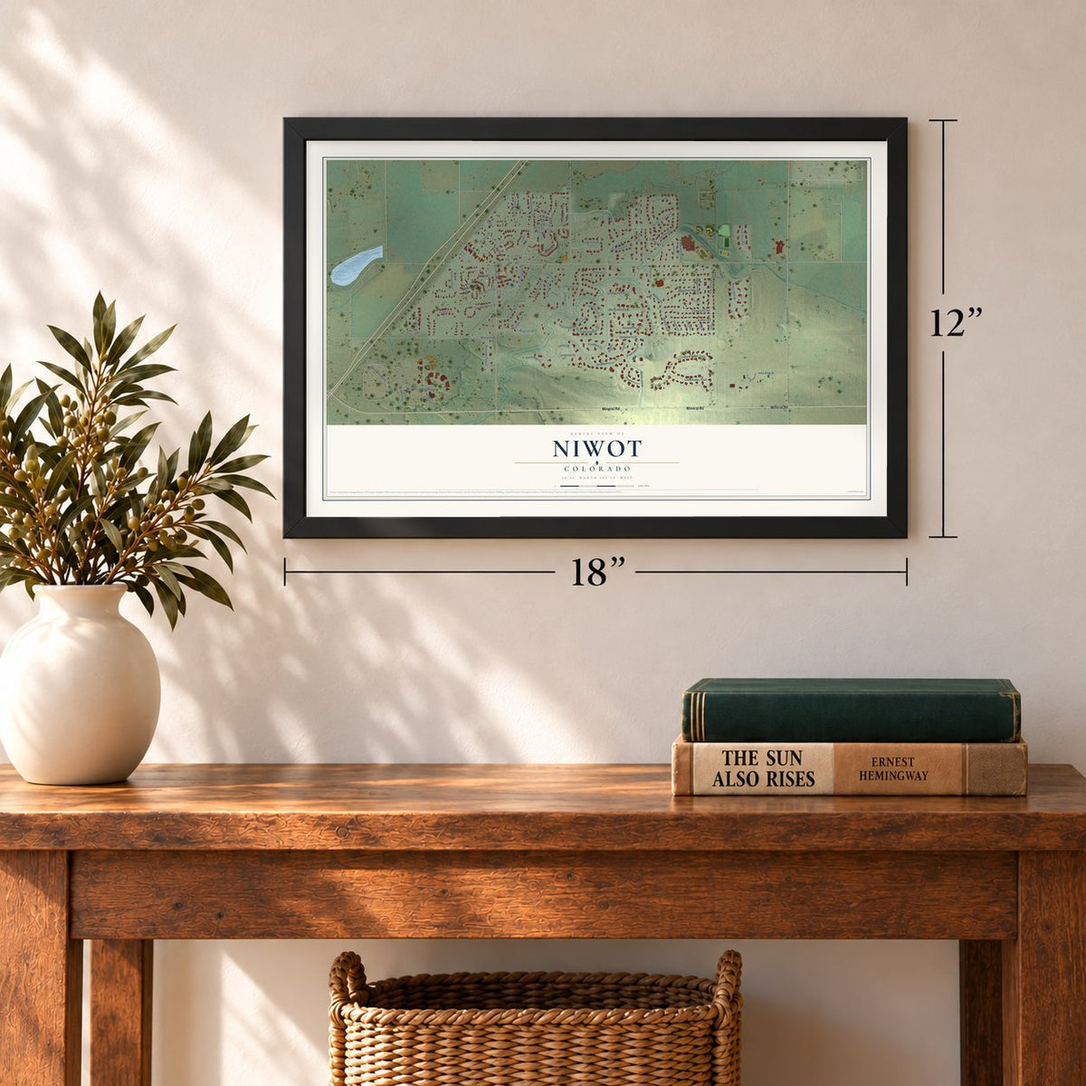 Niwot, Colorado map, 12 x 18 inch print in a black frame in an entryway
