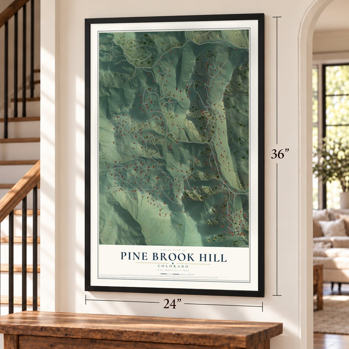 Pine Brook Hill, Colorado map, 24 x 36 inch print in a black frame by a staircase