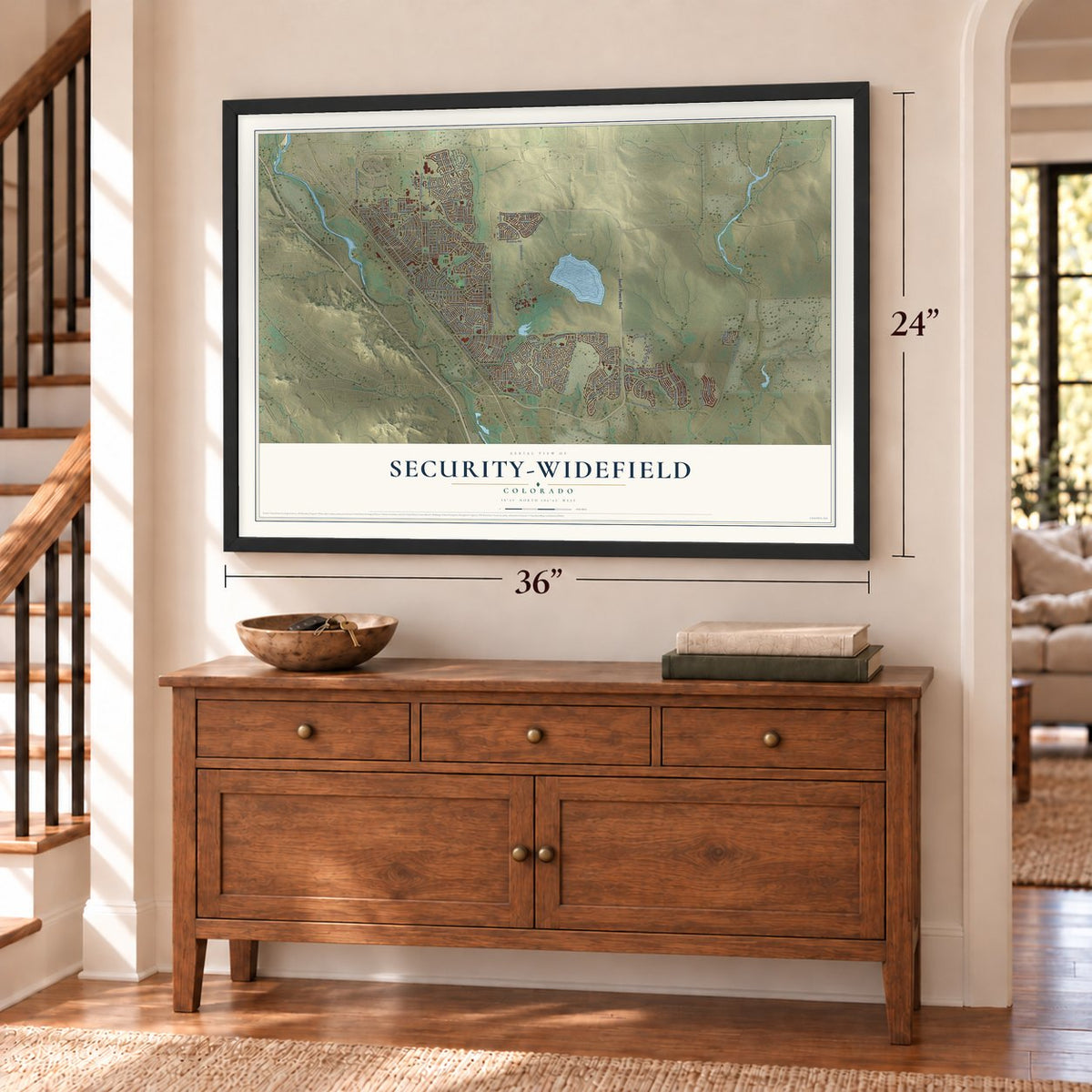 Security-Widefield, Colorado map, 24 x 36 inch print in a black frame above a dresser by a staircase