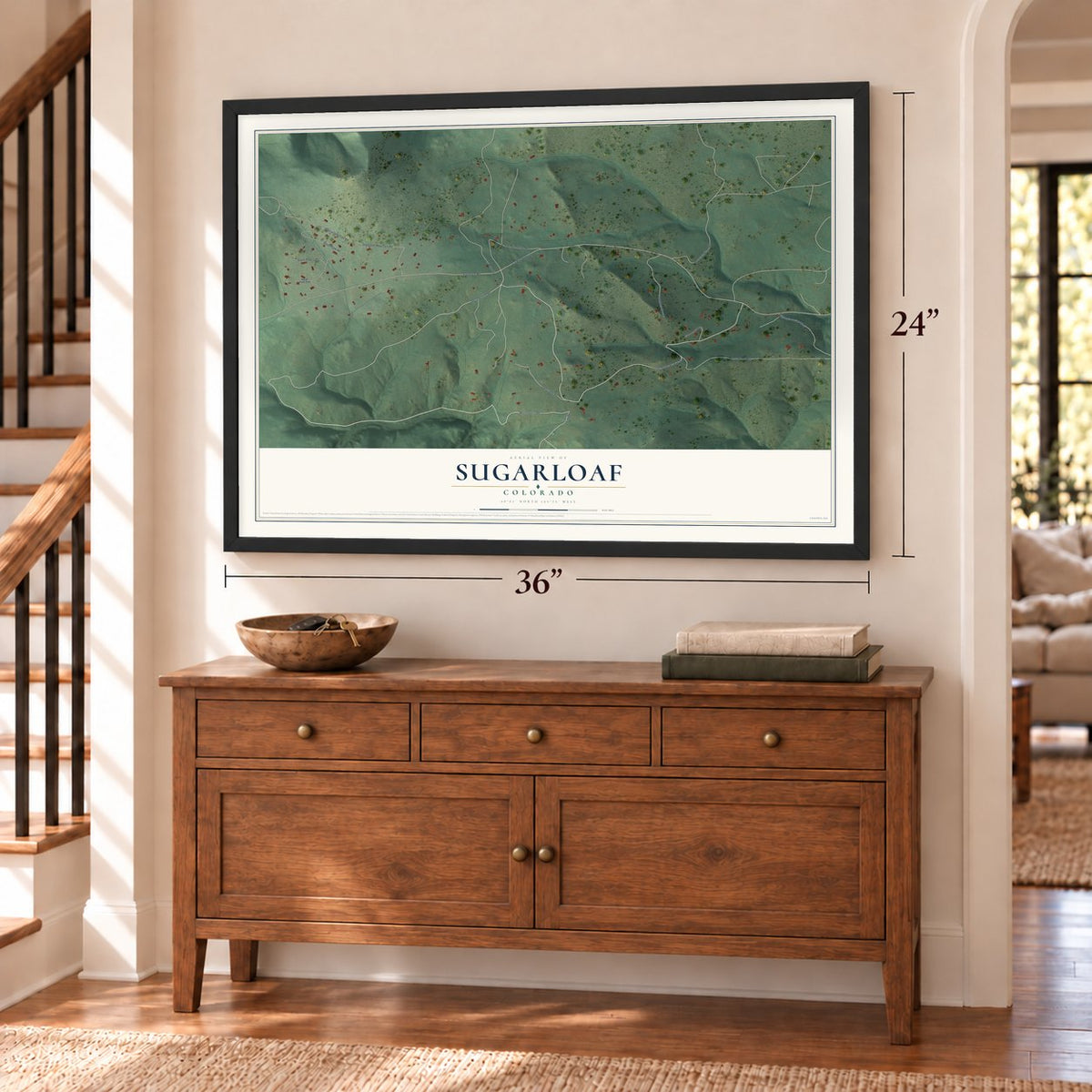 Sugarloaf, Colorado map, 24 x 36 inch print in a black frame above a dresser by a staircase
