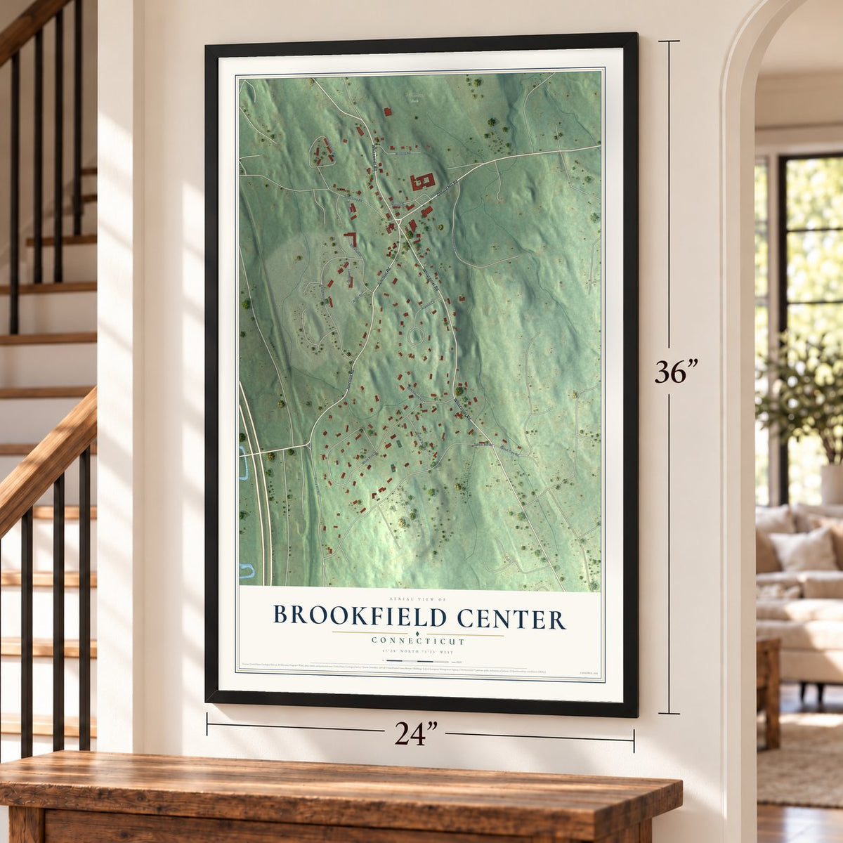 Brookfield Center, Connecticut map, 24 x 36 inch print in a black frame by a staircase
