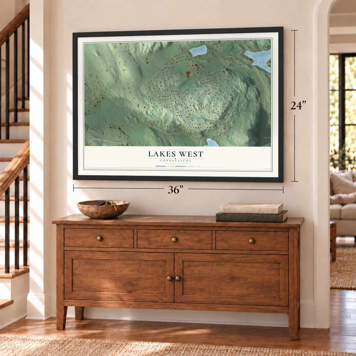Lakes West, Connecticut map, 24 x 36 inch print in a black frame above a dresser by a staircase