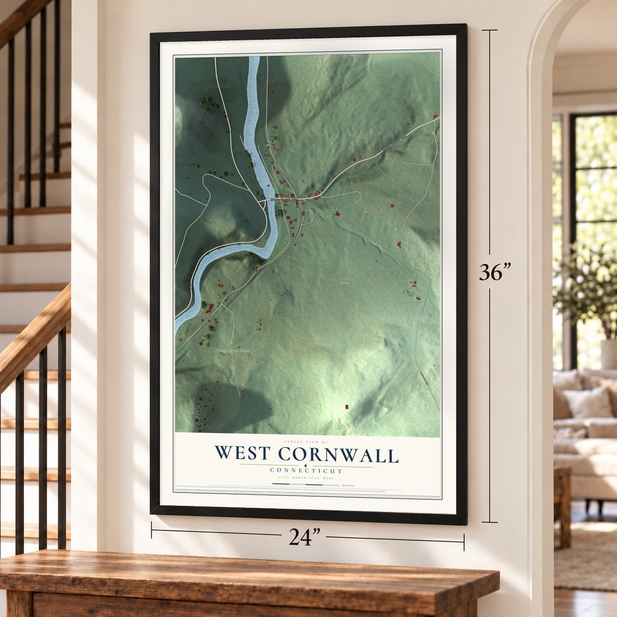 West Cornwall, Connecticut map, 24 x 36 inch print in a black frame by a staircase
