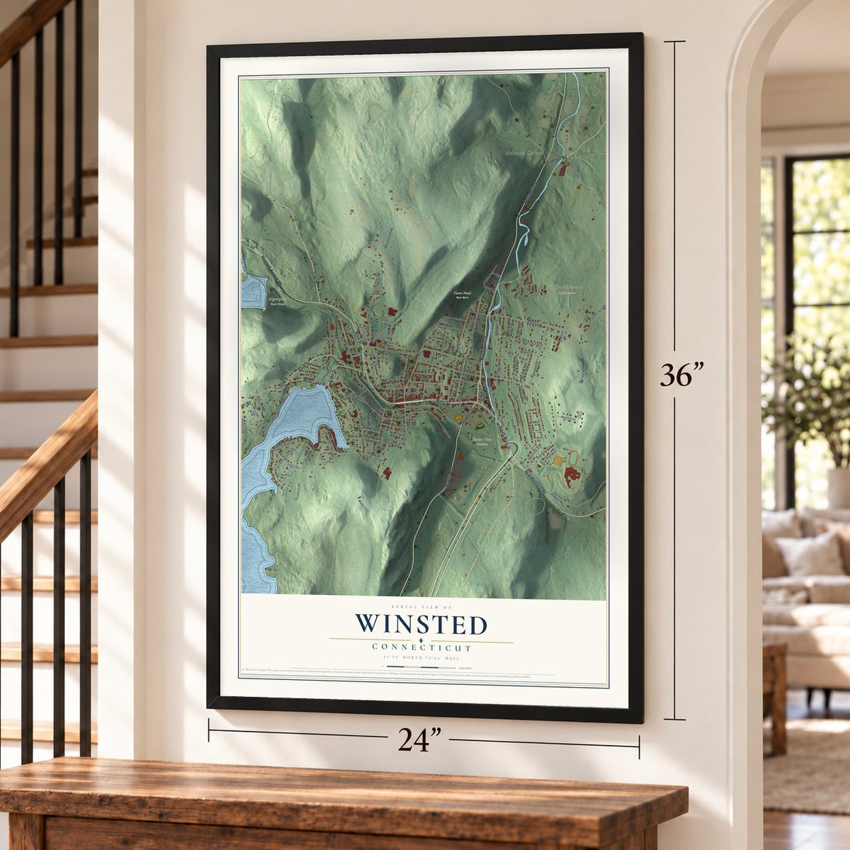 Winsted, Connecticut map, 24 x 36 inch print in a black frame by a staircase